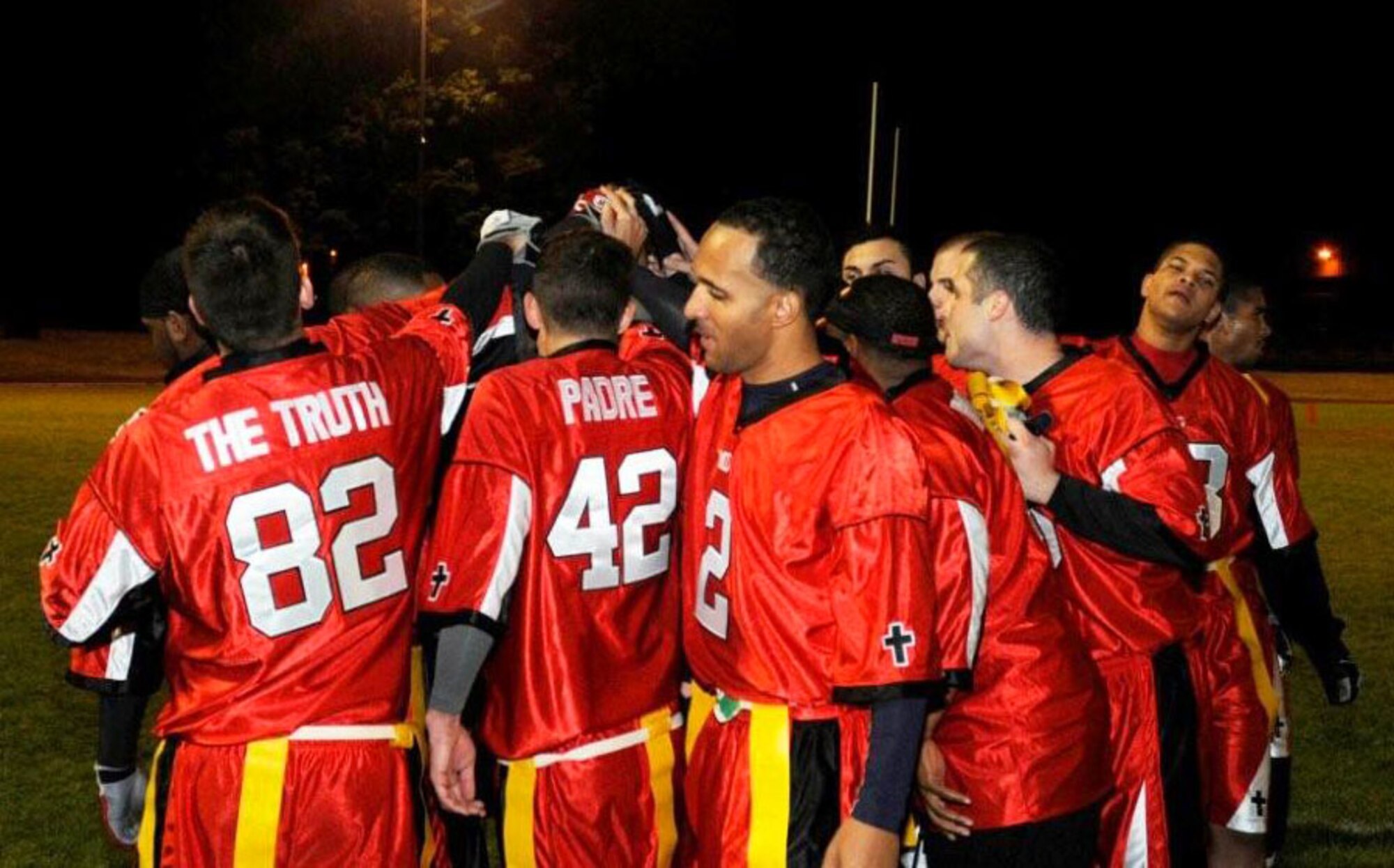 The Medical Group huddle before their game against the Logistics Readiness Squadron during an intramural flag football game Sept. 29, 2009, at RAF Lakenheath, England. The Logistics Readiness Squadron scored in the last minutes of the fourth quarter, to beat MDG 15-14. (U.S. Air Force photo/Airman 1st Class Knox)
