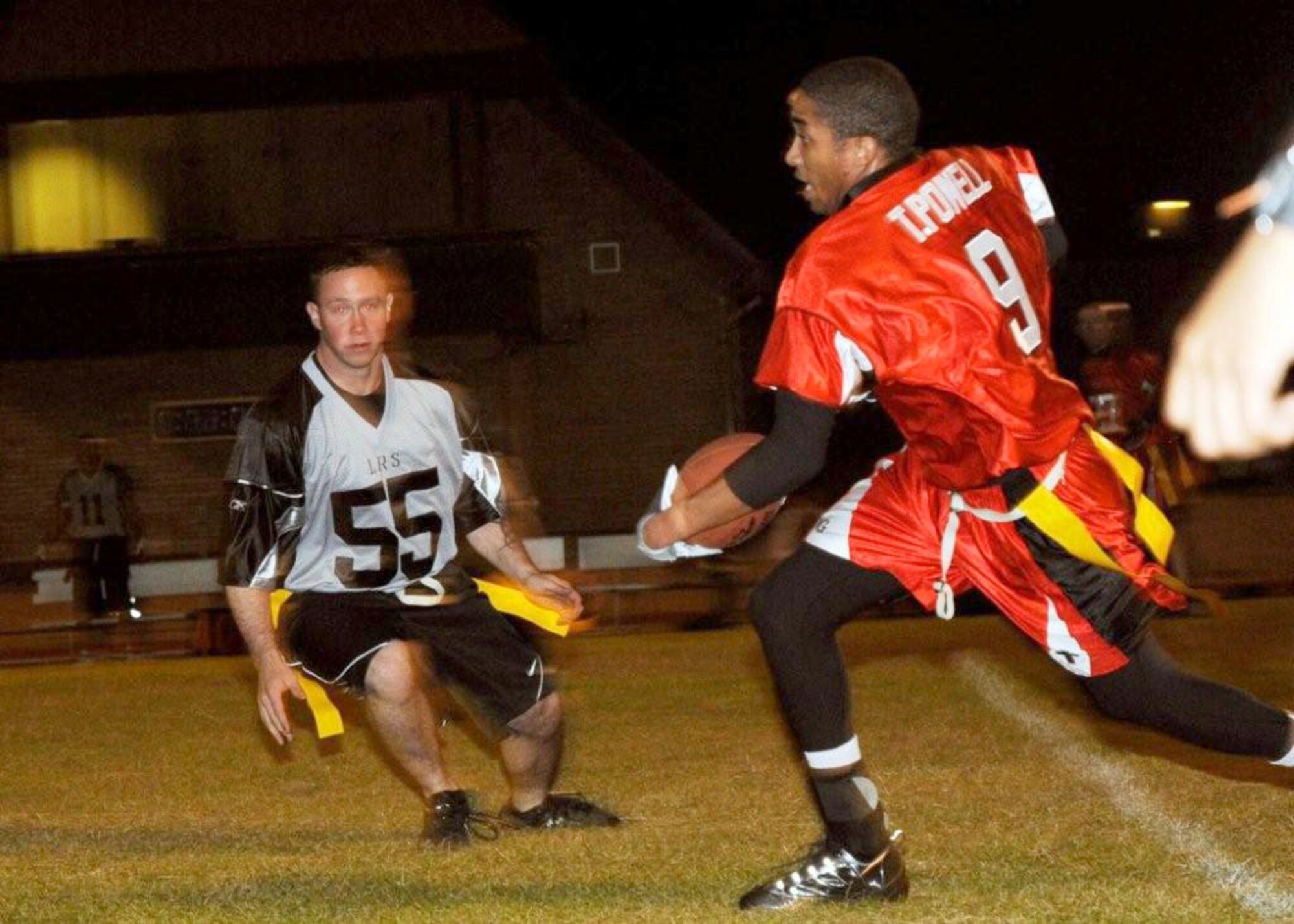 Terrell Powell, Medical Group wide receiver bolts down field for a twenty-yard gain Sept. 29, 2009, at RAF Lakenheath, England. The Logistics Readiness Squadron made a touchdown in the last minutes of the fourth quarter to win the game 15-14. (U.S. Air Force photo/Airman 1st Class Knox)