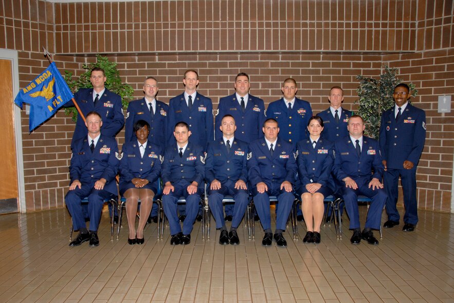 McGHEE TYSON AIR NATIONAL GUARD BASE, Tenn. -- The students of NCO Academy Class 09-6, A-Flight, gather at The I.G. Brown Air National Guard Training and Education Center here, Aug. 31, 2009.  Pictured (L-R standing) are Tech. Sgt. Shawn R. Bergman, Tech. Sgt. Michael D. Schiller, Tech. Sgt. Joseph W. Bishop, Tech. Sgt. Douglas S. Cole, Petty Officer 1st Class Adam D. Barton, Tech. Sgt. Patrick J. Narango, Tech. Sgt. Tyrone E. Melton, (L-R sitting) Tech. Sgt. Carl T. Wiegel,  Tech. Sgt. Jammie T. Jackson, Tech. Sgt. George F. Hoffman, Tech. Sgt. Jonathan M. Bard, Tech. Sgt. Matthew R. Kennedy, Tech. Sgt. Alicia D. Wittke, and Tech. Sgt. Nathan J. Skoglund. (U.S. Air Force photo by Master Sgt. Kurt Skoglund)