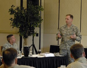 Col. John Wood briefs guests of the U.S. Transportation Command's Component Commanders Conference here Sept. 30. The colonel presented the opening remarks for the conference, outlining the 437th Airlift Wing mission, capabilities and accomplishments. Colonel Wood is the 437 AW commander. (U.S. Air Force photo/Daniel Bowles)