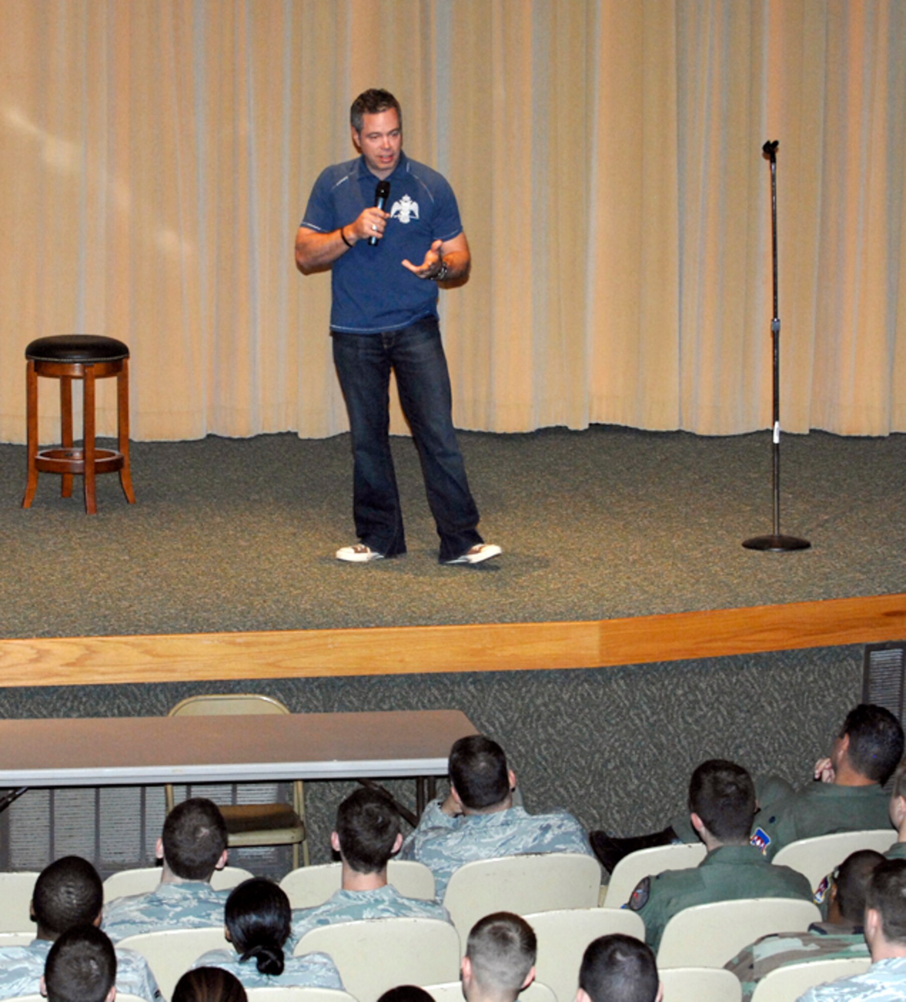 Comedian Bernie McGrenahan addresses an audience of Airmen Sept. 29 in the base auditorium on the dangers of substance abuse. (U.S. Air Force photo/ Terry Wasson)