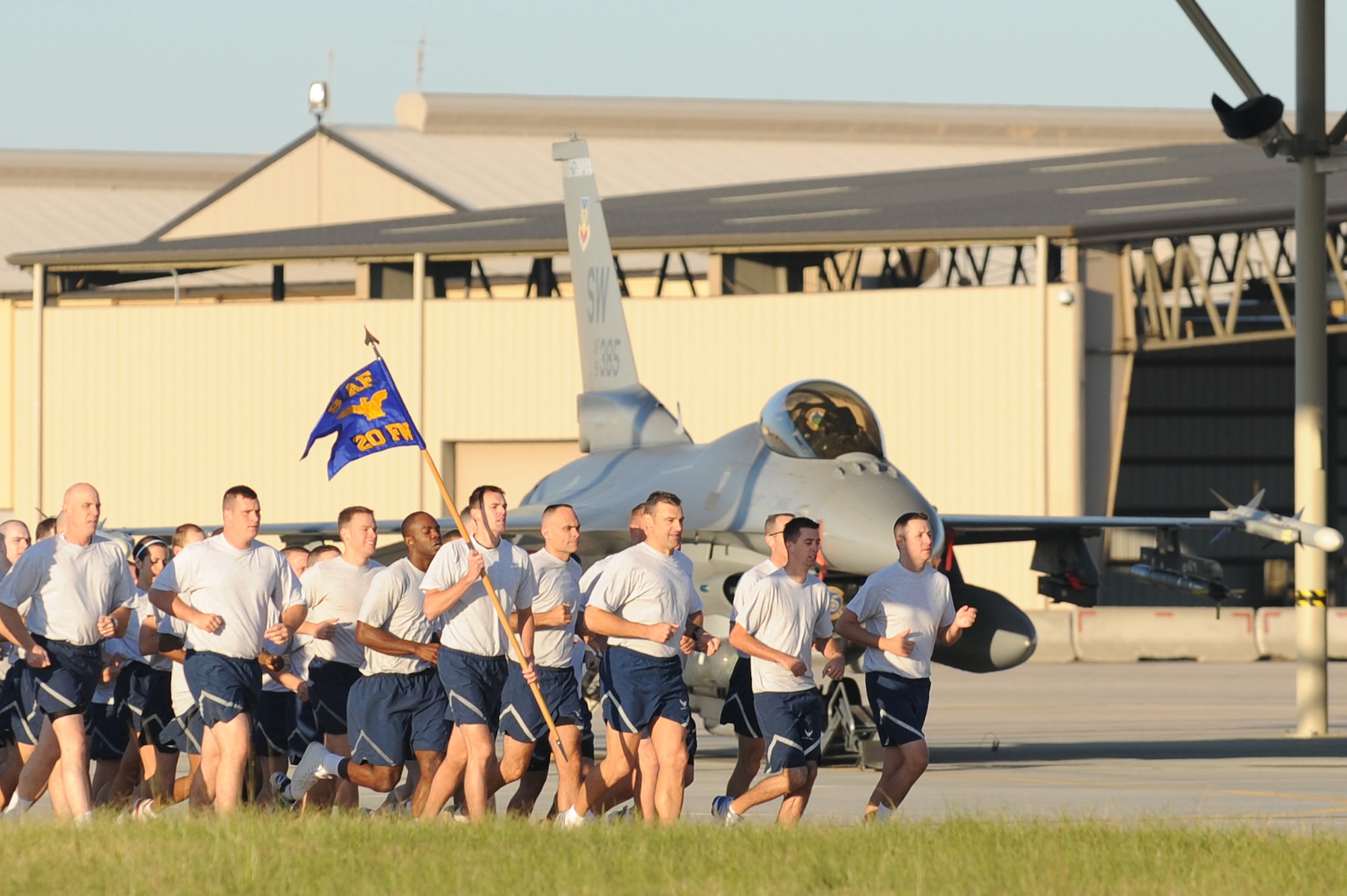 SHAW AIR FORCE BASE, S.C. -- Airmen of the 20th Fighter Wing run in formation on the flightline during the  Safety Day wing run Sept. 30. A wing formation run builds esprit de corps as it brings the different 20th FW groups to run together as a unit. (U.S. Air Force Photo/Senior Airman David Minor)