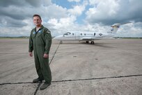 Col. Travis Willis, 479 Flying Training Group commander, stands in front of the flagship T-1A Jayhawk dubbed, 'The Spirit of Pensacola.' The T-1A Jayhawk will be used to train combat systems officers at Naval Air Station Pensacola, Fla., when the 479th FTG begins operations there following an Oct. 2 activation. (U.S. Air Force photo by Steve Thurow)