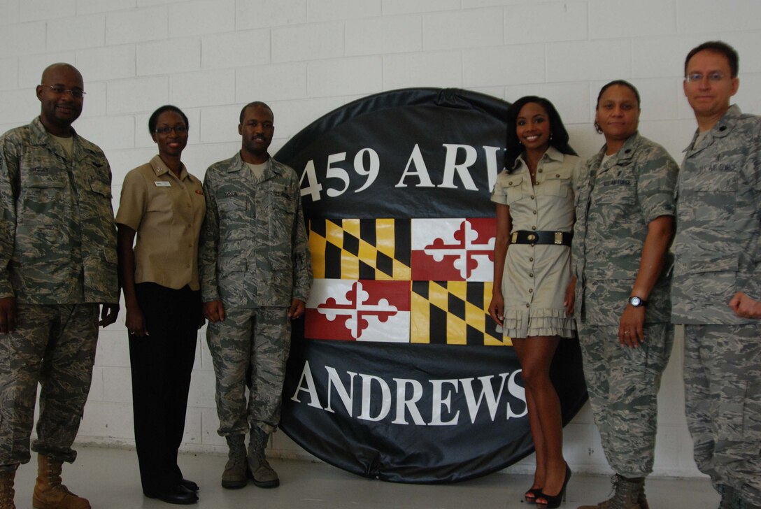 The 459th Air Refueling Wing at Andrews Air Force Base hosted a Family Fun Day Sunday for more than 1300 Reservists and their families who?ve returned from tour overseas. WJLA anchorwoman Cynne Simpson (civilian clothing), who served as MC, is with Staff Sgt. Alex Gray, Michelle Gray, Staff Sgt Travoris Tyson, Lt. Col Naomi DeShore-Osbourne, and Senior Airman Juan Narvaez.(U.S. Air Force Photo/ Senior Airman Drew Palvino)   