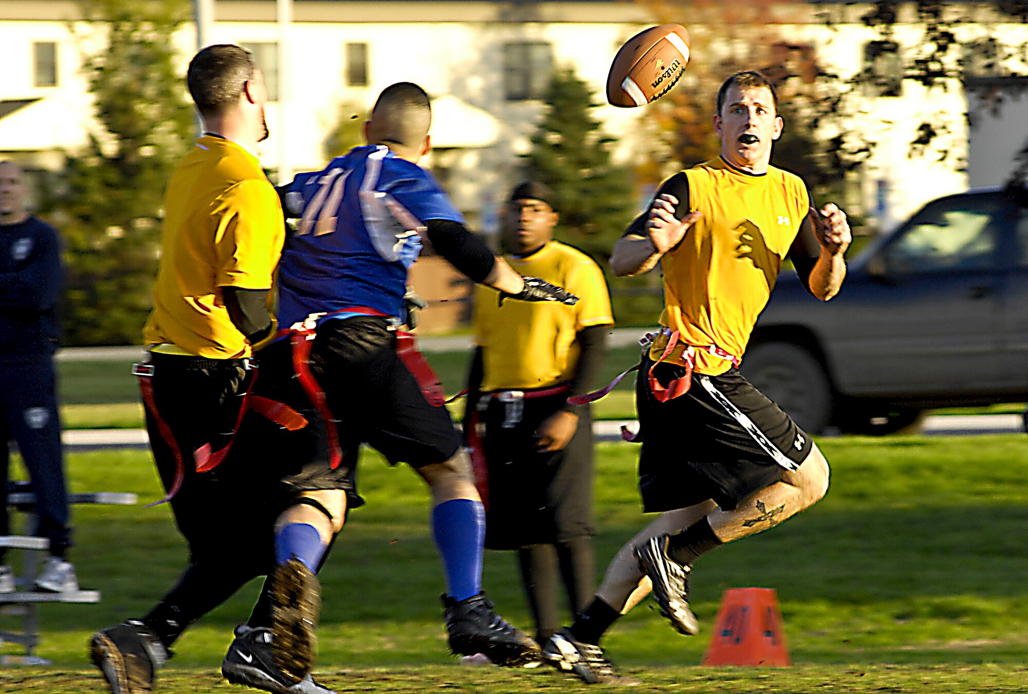ELMENDORF AIR FORCE BASE, Alaska – Quarterback Donnie Millas, 3rd Medical Support Squadron, flips the ball to teammate Chris Walthall during game one of Elmendorf’s flag football finals Sept. 28. The 3rd MDSS dominated the first game over the 3rd CES 22-7 and won its second game 20-14. (U.S. Air Force photo/Airman 1st Class Christopher Gross)