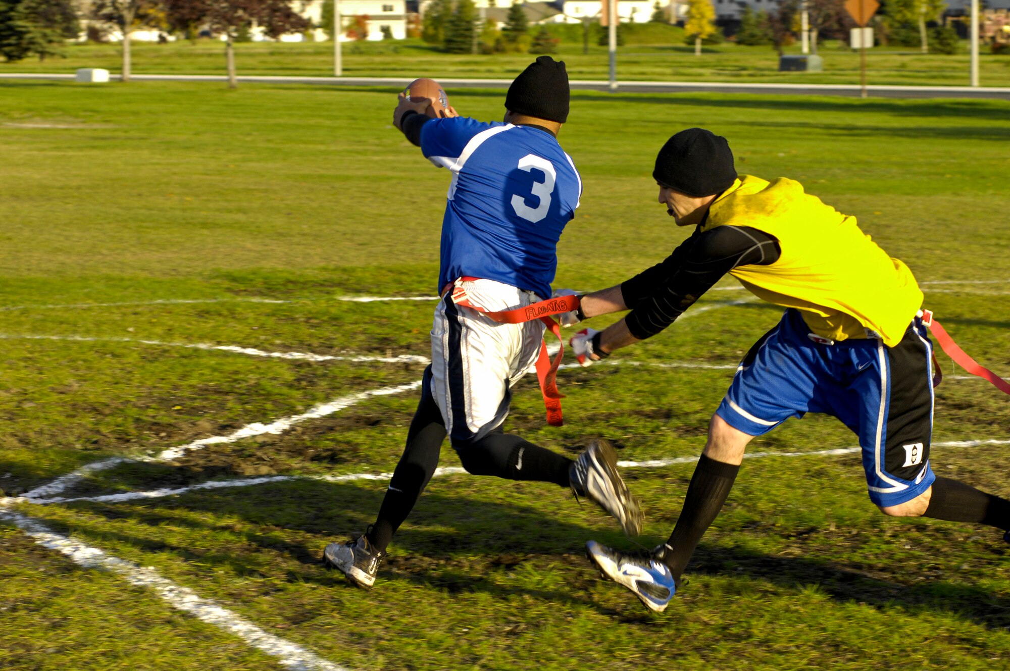 ELMENDORF AIR FORCE BASE, Alaska – Matthew Smith, 3rd Medical Support Squadron, pulls a flag off of Garcia Tarver, 3rd Civil Engineer Squadron, to mark him down at the 1-yard line during game one of two to be played for Elmendorf’s flag football finals Sept. 28. The 3rd MDSS won its first game 22-7 and its second game 20-14. (U.S. Air Force photo/Airman 1st Class Christopher Gross)