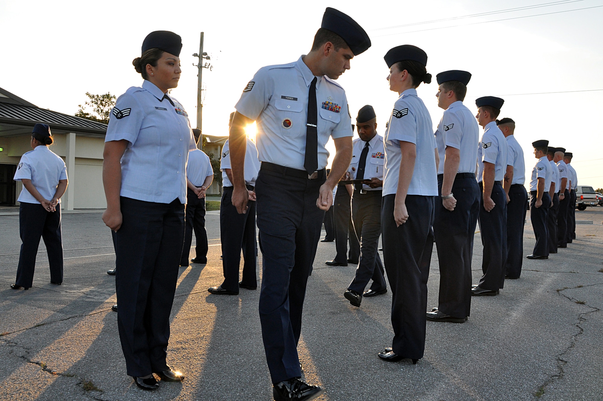 Staff Sgt. Raul Torres, Eglin Airmen Leadership School instructor, inspects his flight during an open ranks inspection Sept. 29 here. Airmen Leadership Instructors look for anything out of place during the open ranks inspection process to include loose strings, improper wear of uniform items and overall appearance of the Airmen’s uniform. (Air Force photo/Staff Sgt. Bryan Franks)