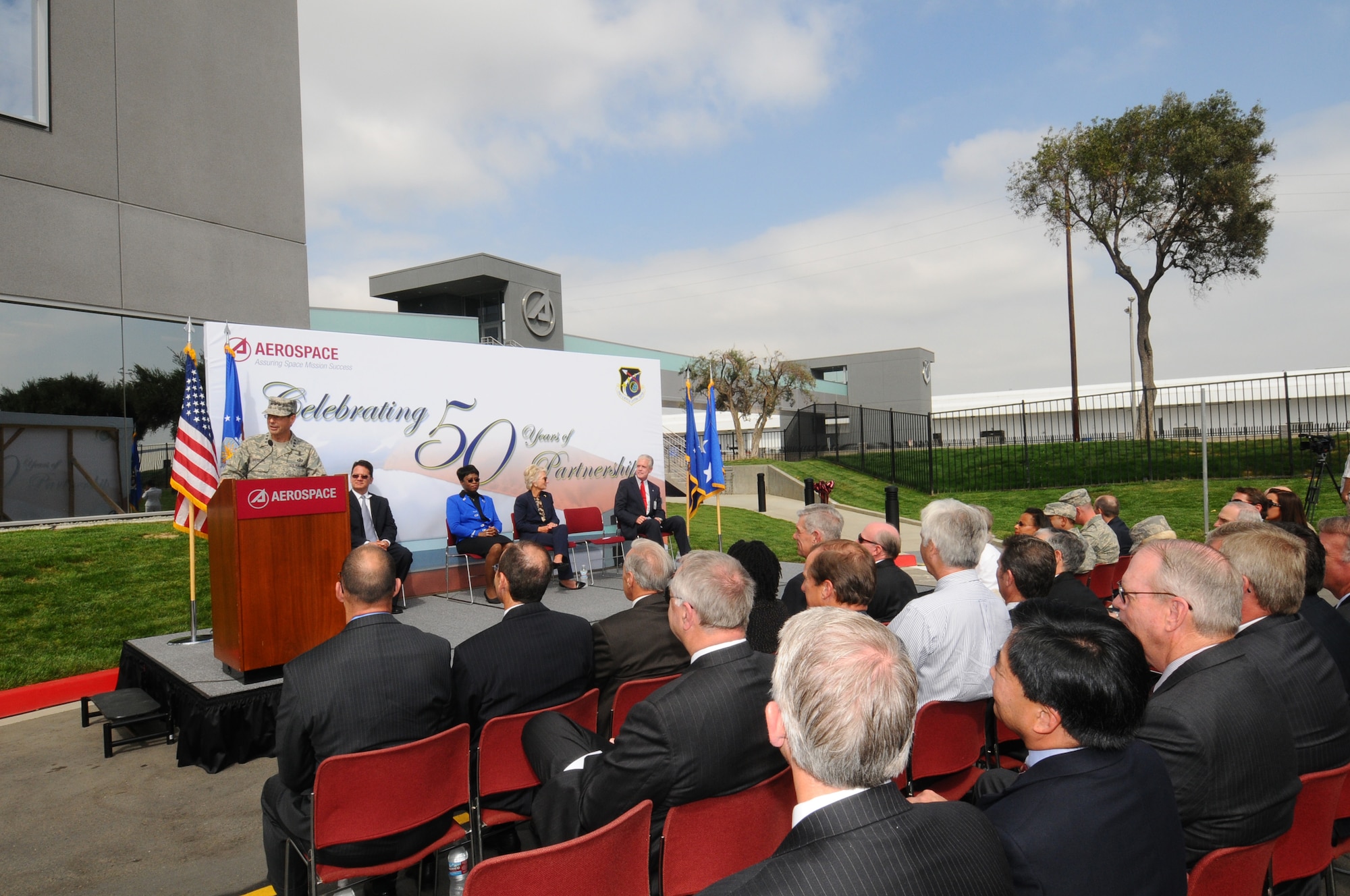 SMC Commander Lt. Gen. Tom Sheridan addresses the crowd at the pedestrian bridge opening ceremony, Sept. 29.  Spanning El Segundo Blvd., the new bridge links Los Angeles Air Force Base and The Aerospace Corporation facilities. (Photo by Lou Hernandez)