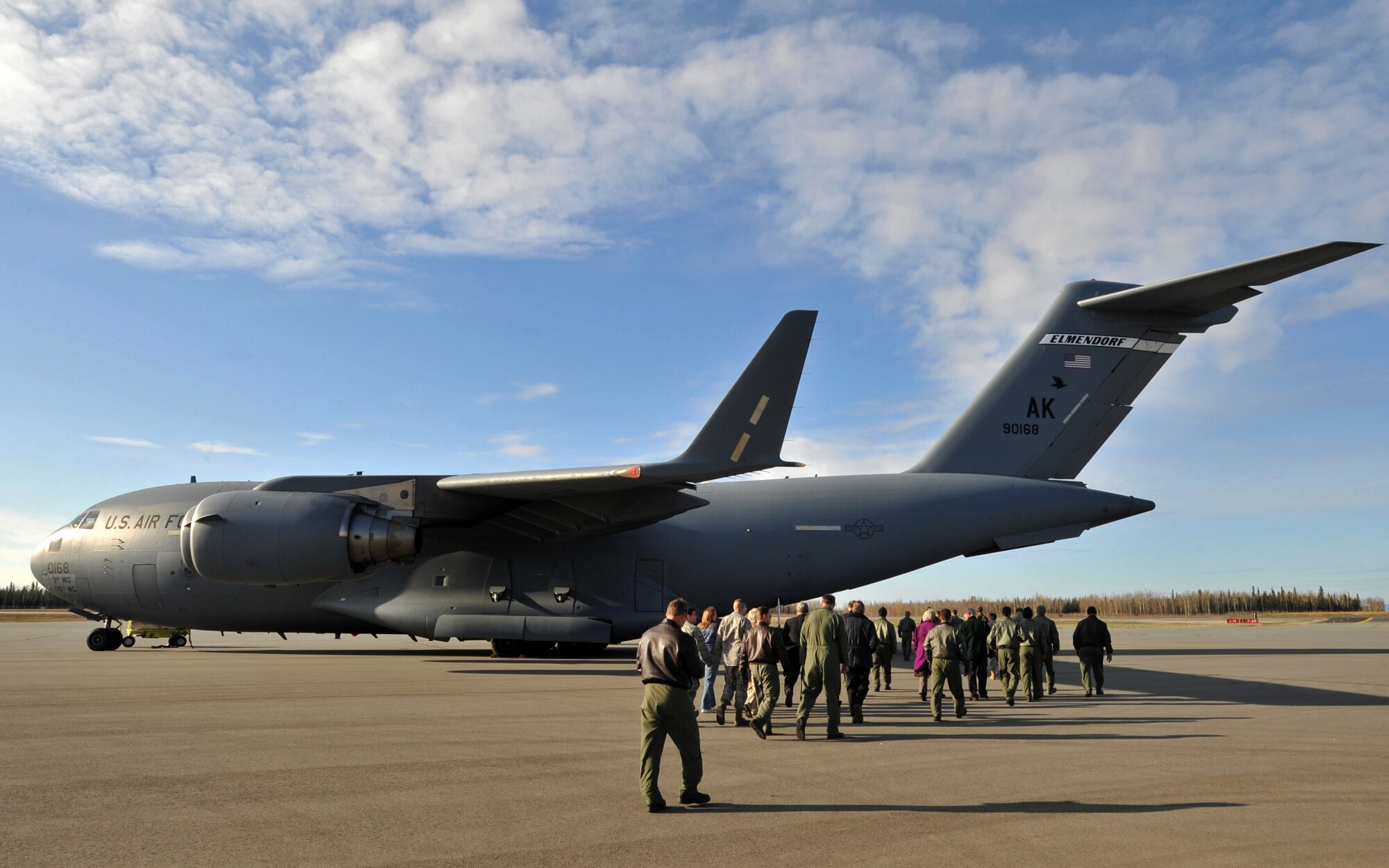 ALLEN ARMY AIRFIELD, Alaska -- An audience gathered for a ribbon cutting ceremony walk to view a C-17 Globemaster III from the 517th Airlift Squadron Sept. 29, 2009. The ceremony was held in celebration of a newly opened runway on Allen Army Airfield. (U.S. Air Force photo/Senior Airman Laura Turner)