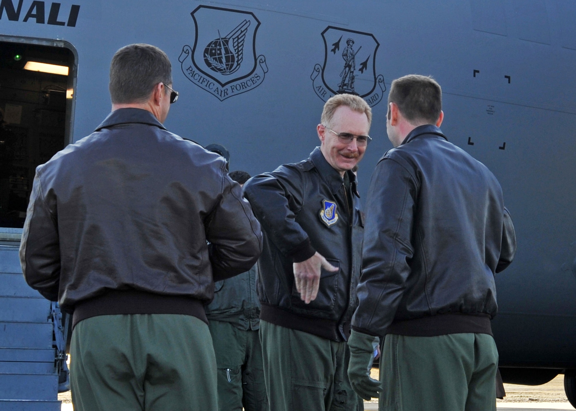 ALLEN ARMY AIRFIELD, Alaska -- Brig. Gen. Charles Foster, 176th Wing Commander, greets Air Force members gathered for a ribbon cutting ceremony at Allen Army Airfield Sept. 29, 2009. The ceremony, accompanied by a C-17 Globemaster III assault landing, was held in recognition of a newly opened runway. (U.S. Air Force photo/Senior Airman Laura Turner)