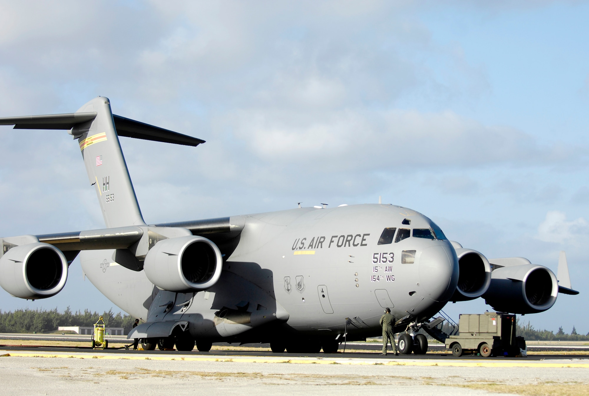 A C-17 Globemaster III sits on the flightline prepared to take off. A similiar C-17 from the 15th Airlift Wing from Hickam Air Force Base, Hawaii, transported 90 Hawaii National Guard members Sept. 30, 2009, to American Samoa after a tsunami struck the island Sept. 29, 2009. (U.S. Air Force photo/TSgt. Shane A. Cuomo)  
