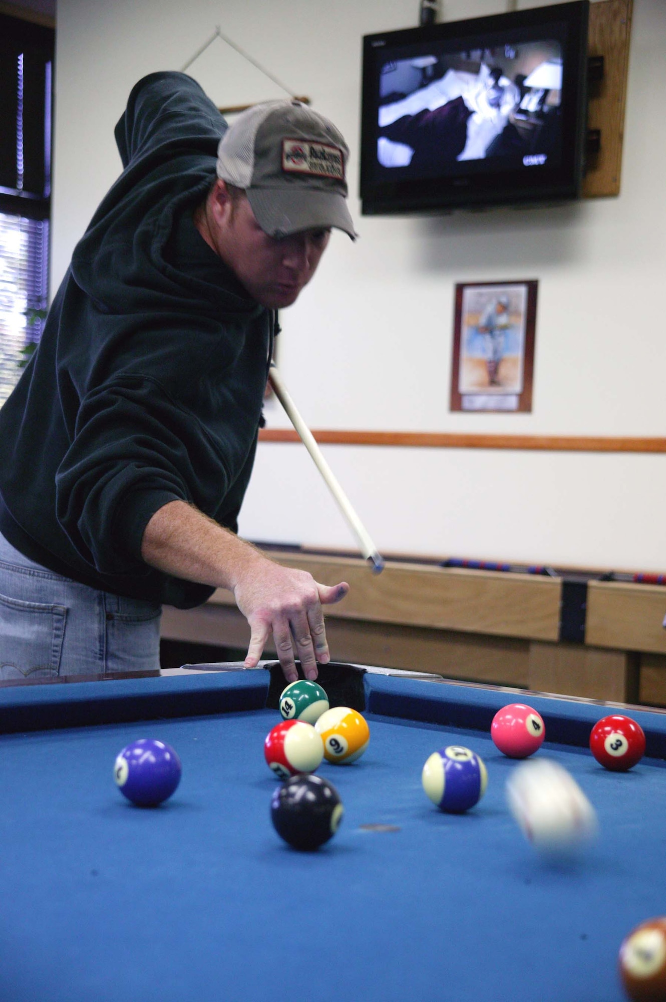 SHAW AIR FORCE BASE, S.C. -- Senior Airman Jeremiah Sams, 682nd Air Support Operations Squadron, performs a jump shot during the billiards challenge of Shaw's Viper Challenge Sept. 29. The annual Viper Challenge, hosted by the fitness center, is a day packed with athletic events and challenges. Each participant plays for their squadron or unit and points are given to the first through fourth place finishers. At the end of the day, the point totals are tallied and the squadron with the most points wins. (U.S. Air Force photo/Staff Sgt. John Gordinier)