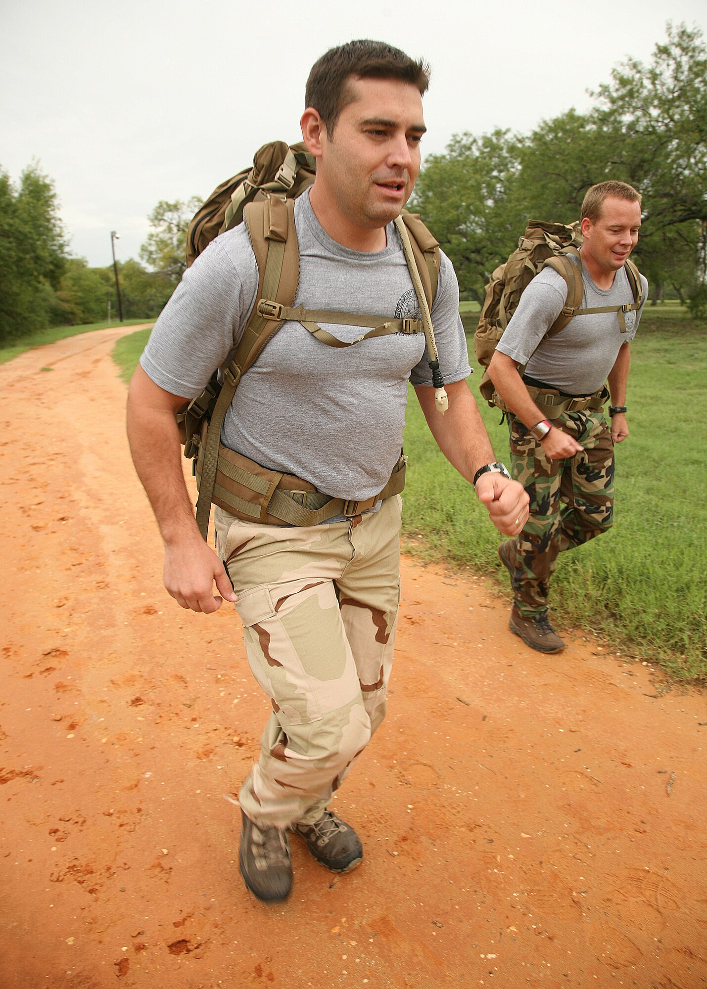 1st Lt. Sam Schindler (left) and Master Sgt. Kenneth Huhman, both with the 342nd Training Squadron, prepare at Lackland's Training Annex for the 150 mile ruck march they will be doing in honor of 12 fallen special tactics Airmen killed in Iraq and Afghanistan.