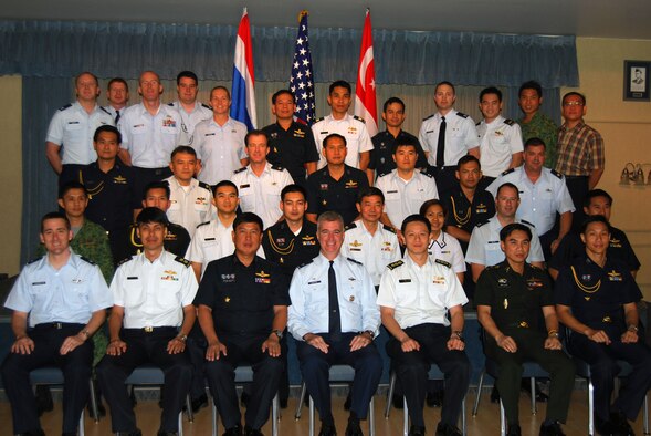 Representatives from Thailand, Singapore and the United States armed forces gather for a group photo after working out the details for the upcoming Cope Tiger exercise in Thailand in March 2010 at a conference held Sept 21-25 at Elemendorf Air Force Base, Alaska. Cope Tiger is an annual, multilateral aerial exercise which divides Thai, Singaporean and U.S. Air Force, Navy and Marine Corps aircraft into two mixed groups, pitting them against each other in a mock battle. The exercise also includes a two-phase humanitarian and civic assistance portion (Courtesy photo)