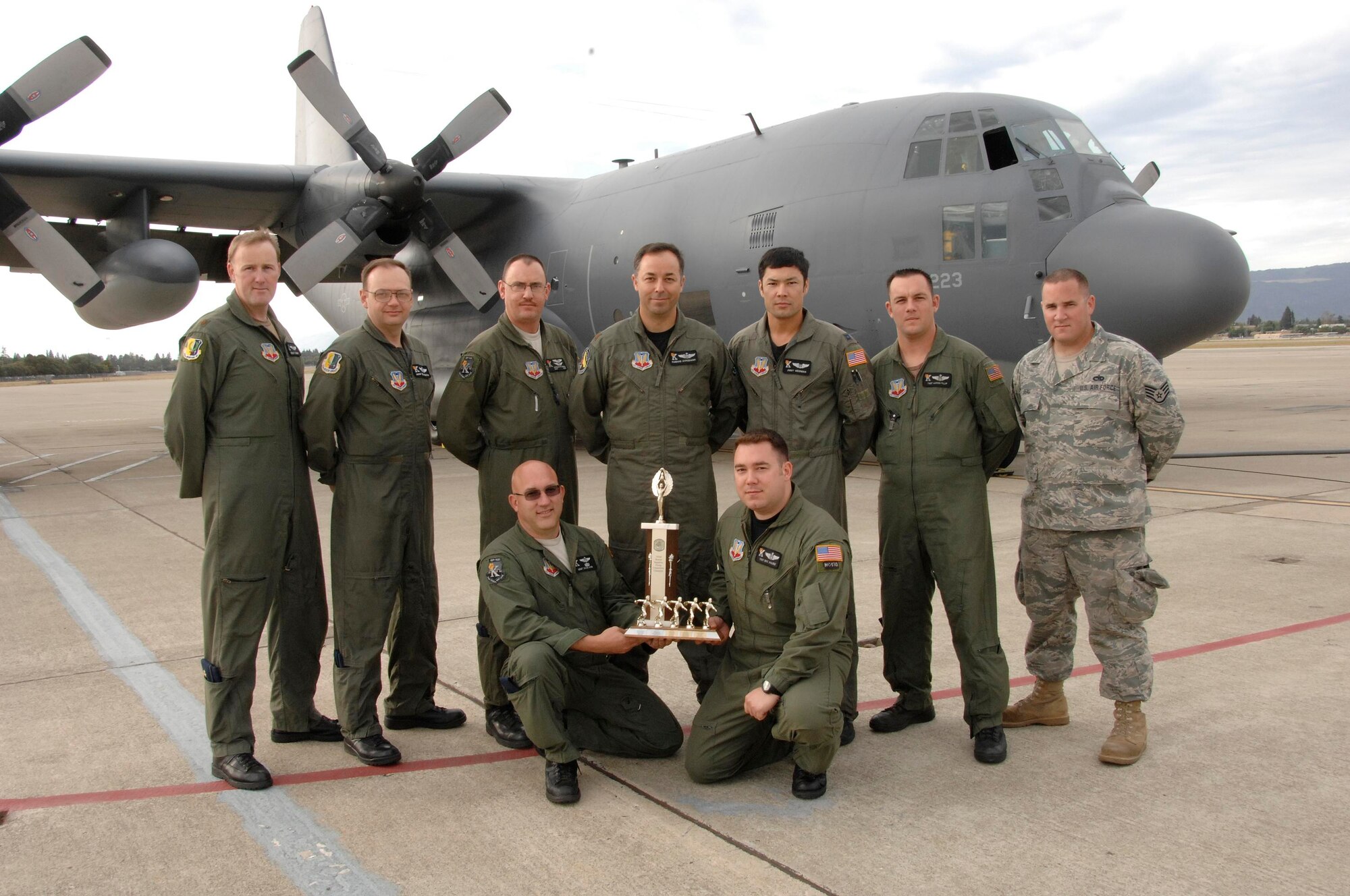 An MC-130P Combat Shadow crew from the 129th Rescue Wing won first place in a combat search and rescue flying competition Sept.13 at Gabreski Airport, N.Y. The crew, King 53, poses with the trophy. Back row, from left to right: Maj. Jeremy Guenet, co-pilot, Senior Master Sgt. Reed Johnston, radio operator, Staff Sgt. Douglas Quayle, flight engineer, Maj. Jose Agredano, aircraft commander, Capt. Jimmy Weidman, navigator, Tech. Sgt. Aaron Fillip, loadmaster, and Staff Sgt. Tom Beall, crew chief. Front row, from left to right: Senior Master Sgt. David King, flight engineer and Tech. Sgt. Eric Valdez, loadmaster. Not pictured: 1st Lt. Kenly Lok, navigator. (Air National Guard photo by Tech. Sgt. Ray Aquino)
