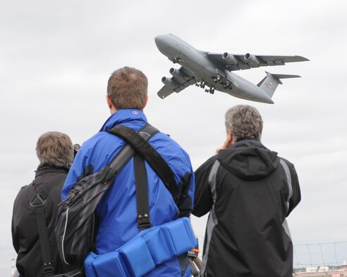 Members from the Combined Noise Abatement Committee and Spangdahlem Air Base, Germany, watch a C-5M acoustic demonstration on Ramstein Air Base, Germany, Sept. 30, 2009.  The CNAC consists of members of the Kaiserslautern Military Community and local German officials who regularly meet to discuss noise abatement issues in the community.  The meeting was followed by a briefing and demonstration that focused on the Air Force’s new C-5M.  Part of the Air Force's continual effort to modernize its inventory, the new model provides increased climb capability and produces less noise when compared to previous C-5 models. Ramstein is a major hub for mobility and airlift operations throughout Europe and downrange, and hosts a variety of other aircraft on its flightline, to include C-5s.  (U.S. Air Force photo by Tech. Sgt. Sean Mateo White)