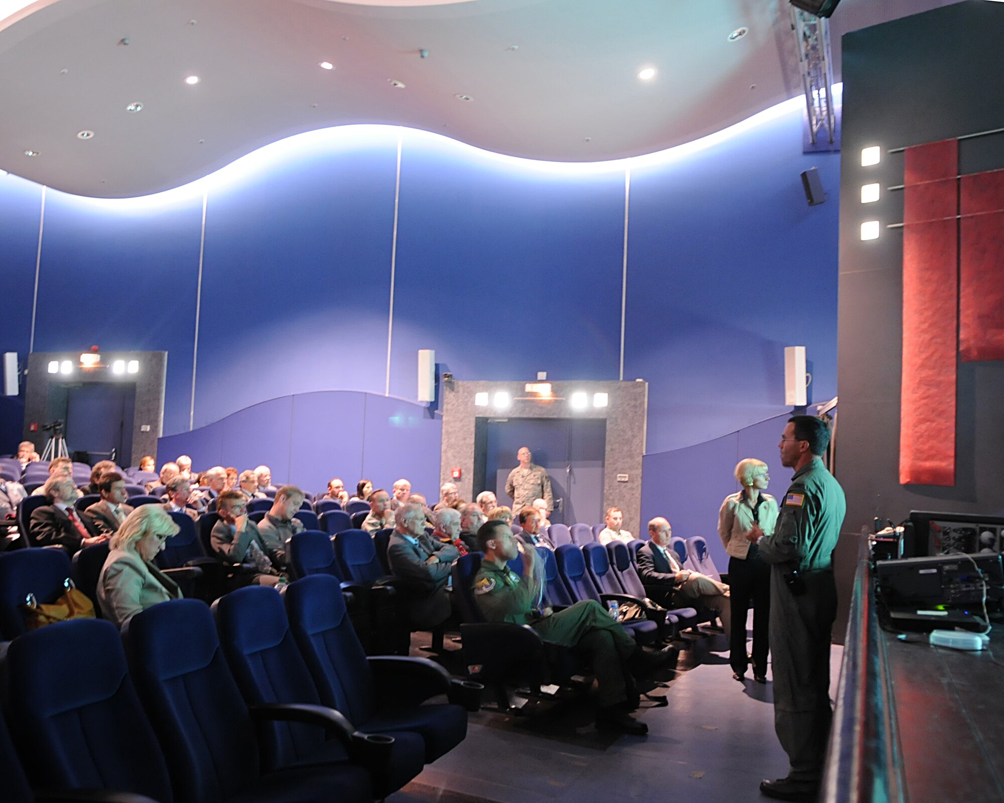 Members from the Combined Noise Abatement Committee and Spangdahlem Air Base, Germany, receive a briefing on the new C-5M at the Hercules Theater on Ramstein Air Base, Germany, Sept. 30, 2009.  Representatives from Air Mobility Command and Lockheed Martin provided an overview of the new model's capabilities, which include increased climb capability and less noise when compared to previous C-5 models. The CNAC consists of members of the Kaiserslautern Military Community and local German officials who regularly meet to discuss noise abatement issues in the community.  The meeting was followed by a briefing and demonstration that focused on the Air Force’s new C-5M.  The new enhancement to the C-5 is part of the Air Force's continual effort to modernize its inventory. Ramstein is a major hub for mobility and airlift operations throughout Europe and downrange, and hosts a variety of other aircraft on its flightline, to include C-5s.  (U.S. Air Force photo by Tech. Sgt. Sean Mateo White)