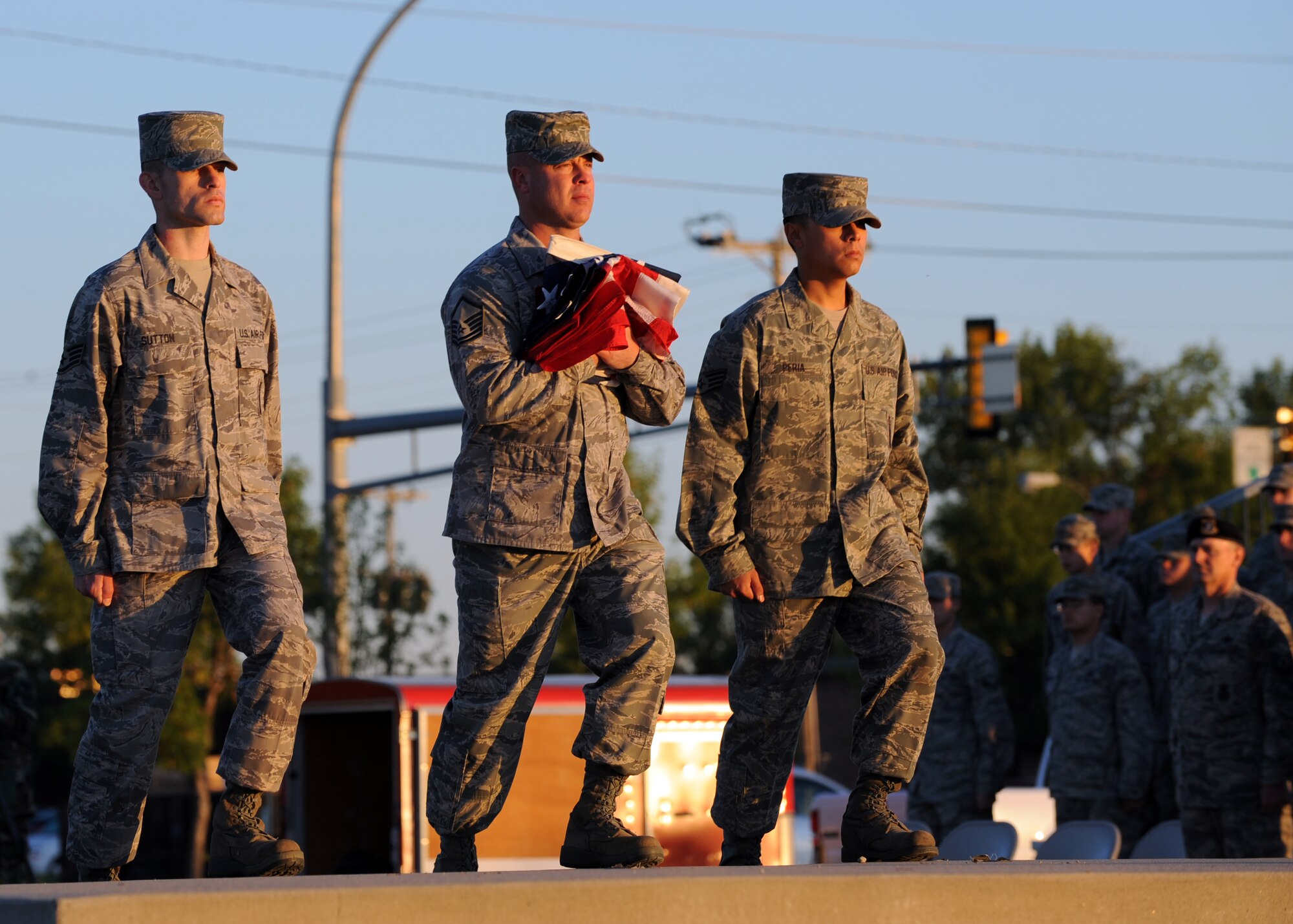 MINOT AIR FORCE BASE, N.D. -- Staff Sgt. Dan Sutton, 91st Missile Maintenance Squadron missile radiation technician, Master Sgt. Michael Harden, 91st Operations Group first sergeant, and Staff Sgt. David Peria, 91st Missile Maintenance Squadron electro-mechanical team supervisor, walk towards the base flag pole during the opening ceremony in honor of POW/MIA day here Sept. 25. POW/MIA day is a day of remembrance for all those who have served our nation’s calling, but not yet returned home. (U.S. Air Force photo by Staff Sgt. Keith Ballard.)
