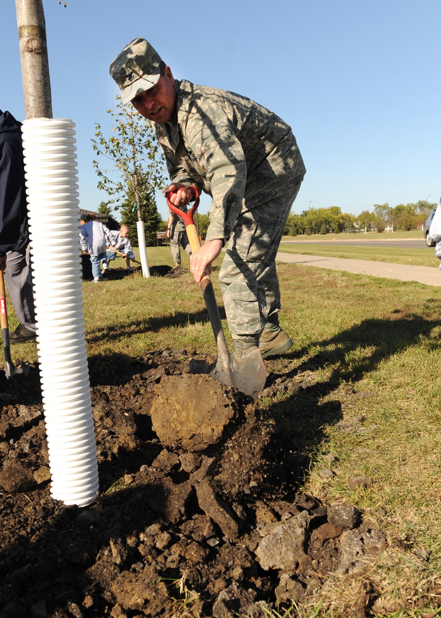 Col. John Michel, 319th Air Refueling Wing commander, shovels dirt during the wing’s Arbor Day celebration Sept. 29 on Grand Fork Air Force Base, N.D. (U.S. Air Force photo by Staff Sgt. Suellyn F. Nuckolls)