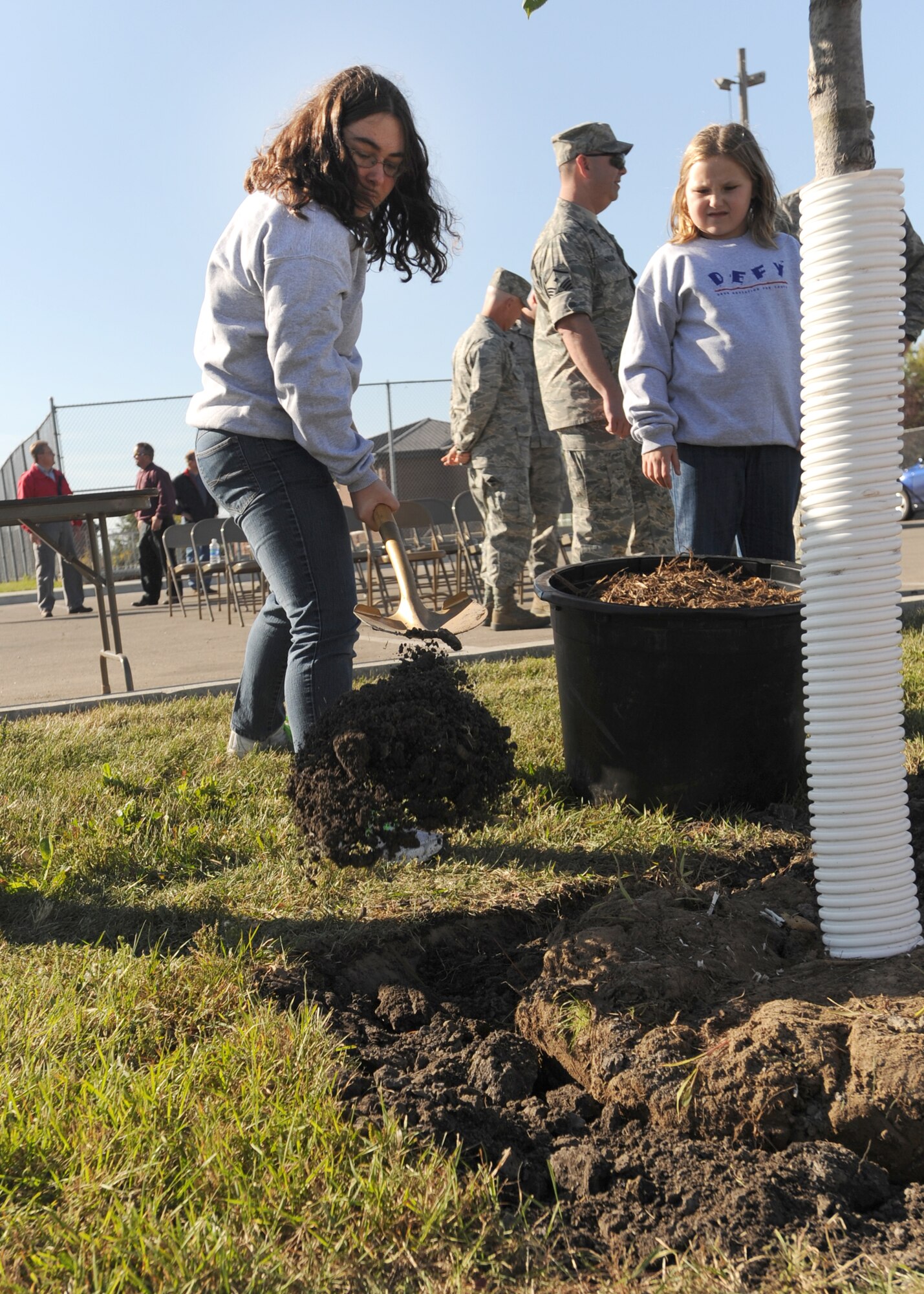 Michaela Murray, daughter of Jessica Murray, 319th Force Support Squadron, shovels dirt during the 319th ARW’s Arbor Day celebration Sept. 29 on Grand Fork Air Force Base, N.D. (U.S. Air Force photo by Staff Sgt. Suellyn F. Nuckolls)