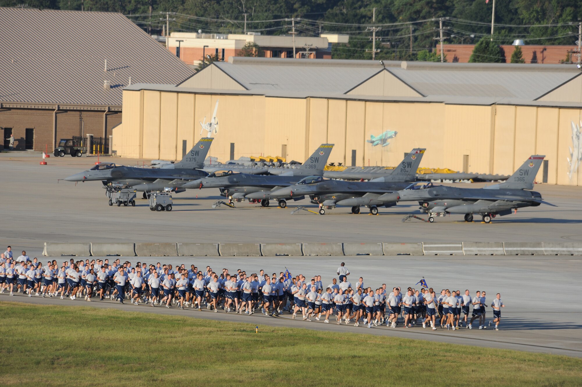 SHAW AIR FORCE BASE, S.C. -- Airmen from the 20th Fighter Wing run in formation along the flight line during Wing Safety Day Sept. 30. A wing formation run builds esprit de corps as it brings the different 20th FW groups to run together as a unit. (U.S. Air Force photo/Senior Airman Matt Davis)