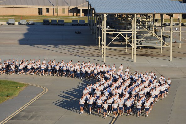 SHAW AIR FORCE BASE, S.C. -- Airmen from the 20th Fighter Wing run in formation along the flight line during Wing Safety Day Sept. 30. A wing formation run builds esprit de corps as it brings the different 20th FW groups to run together as a unit. (U.S. Air Force photo/Senior Airman Matt Davis)