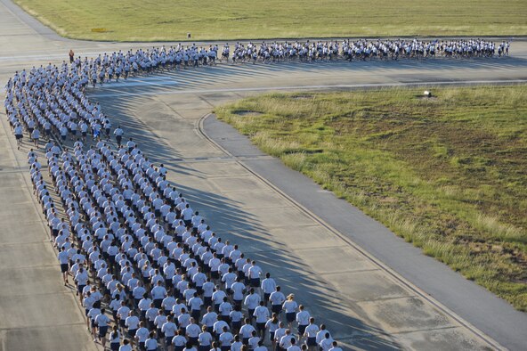 SHAW AIR FORCE BASE, S.C. -- Airmen from the 20th Fighter Wing run in formation along the flight line during Wing Safety Day Sept. 30. A wing formation run builds esprit de corps as it brings the different 20th FW groups to run together as a unit. (U.S. Air Force photo/Senior Airman Matt Davis)