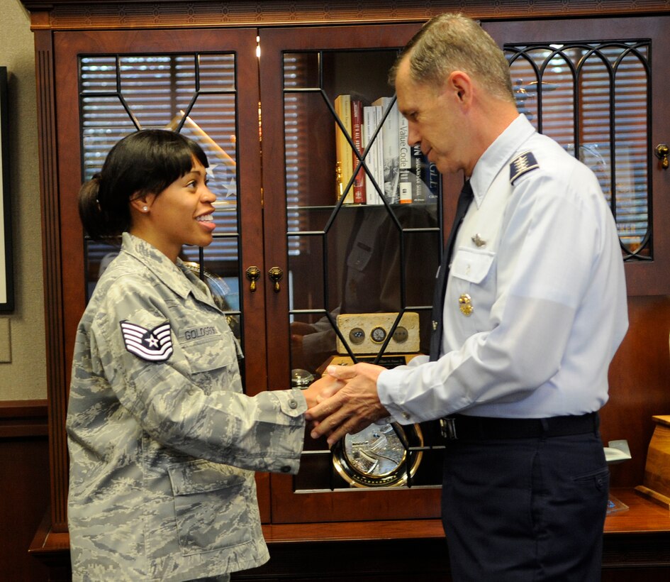 LANGLEY AIR FORCE BASE, Va. - Tech. Sgt. Shebon Goldsboro, 15th Intelligence
Squadron, thanks Gen. William Fraser, Air Combat Command commander , after her promotion Sept 28. Sergeant Goldsboro was promoted to technical sergeant under the Stripes for Exceptional Performers program. (U.S. Air Force Photo/Senior Airman Dana Hill)
