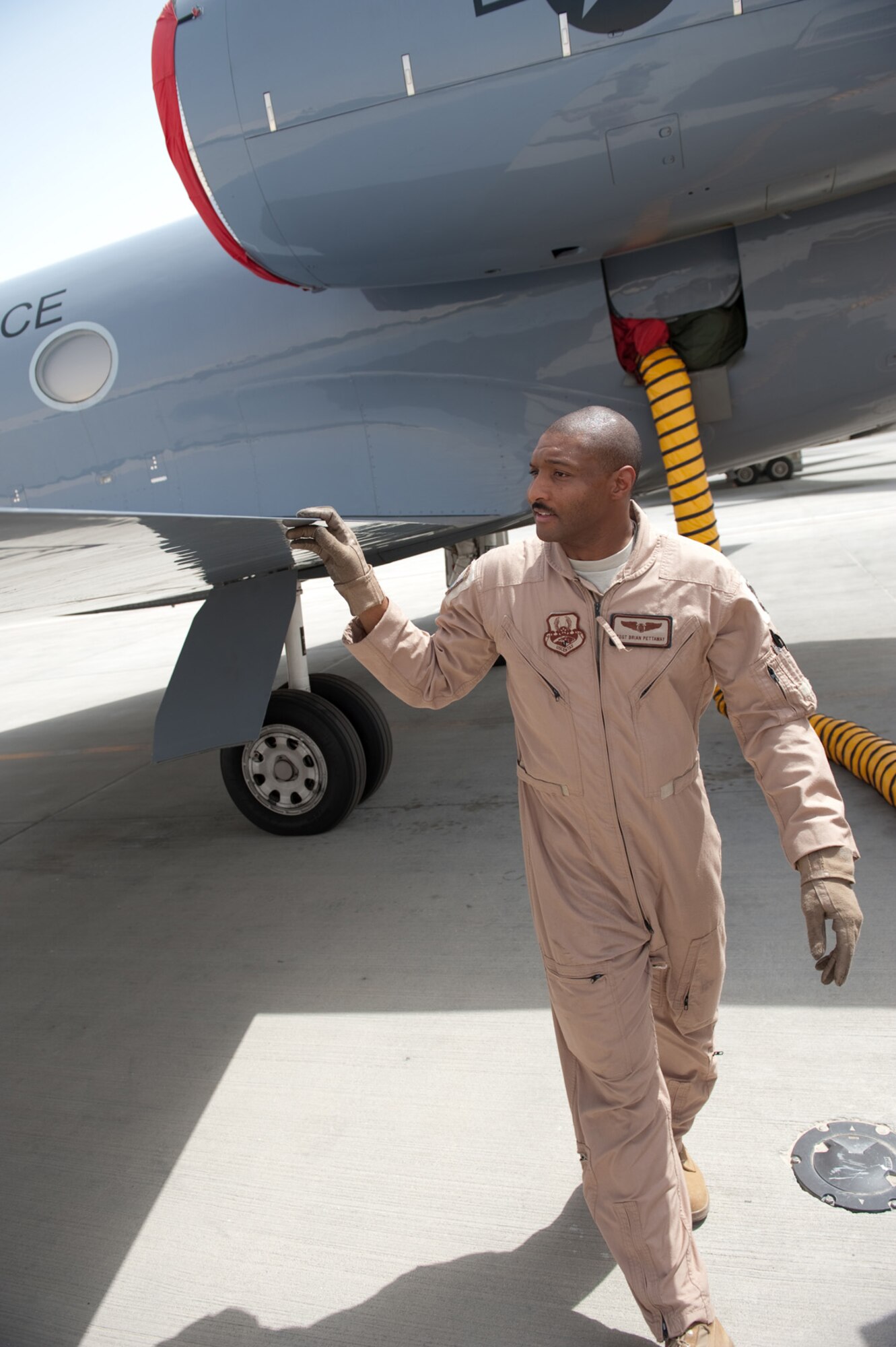 SOUTHWEST ASIA - Tech. Sgt. Brian Pettaway, a C-20H flight engineer with the 379th Expeditionary Operations Group, performs a preflight check prior to taking off on a mission, Sept. 25, 2009, in Southwest Asia. Sergeant Pettaway ensures the aircraft is functional to support airlift missions for high-ranking government and Department of Defense officials. Sergeant Pettaway is deployed from Ramstein Air Base, Germany, in support of Operations Iraqi Freedom and Enduring Freedom. (U.S. Air Force photo/Staff Sgt. Robert Barney) 
