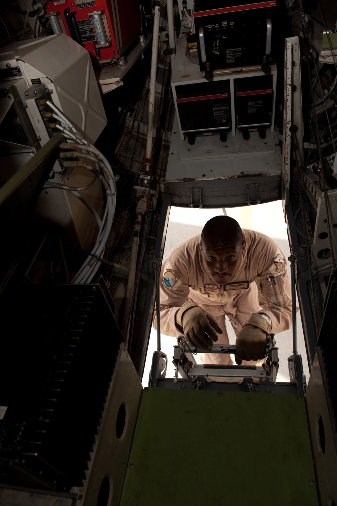 Tech. Sgt. Brian Pettaway, a C-20H flight engineer with the 379th Expeditionary Operations Group, performs a preflight check prior to taking off on a mission, Sept. 25, in Southwest Asia. Sergeant Pettaway ensures the aircraft is functional for world-wide airlift missions for high-ranking government and Department of Defense officials. Sergeant Pettaway is deployed from Ramstein Air Base, Germany, in support of Operations Iraqi and Enduring Freedom. (U.S. Air Force photo/Staff Sgt. Robert Barney) 