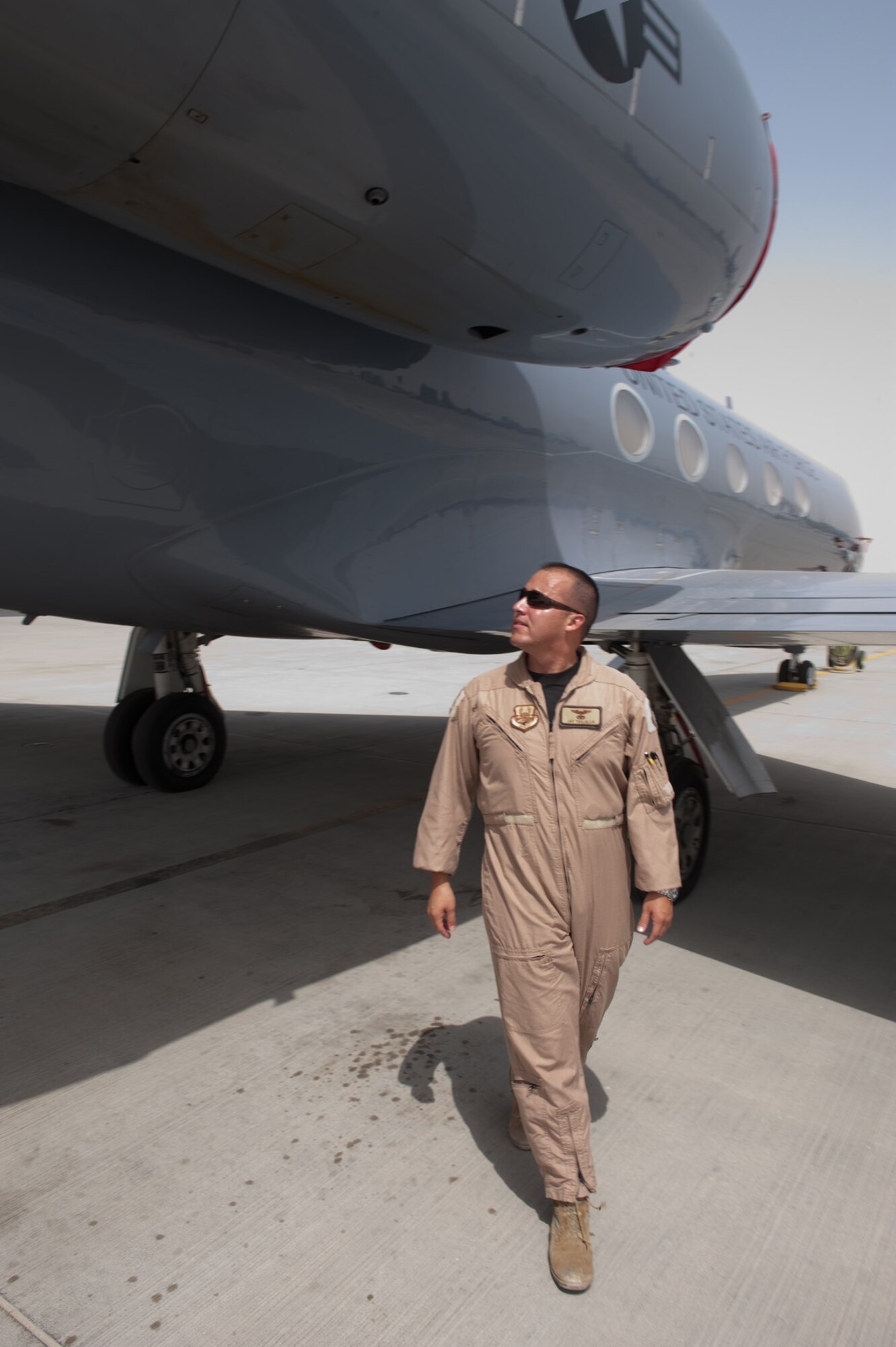 Capt. Jay Trujillo, a C-20H pilot with the 379th Expeditionary Operations Group, performs a preflight check of his aircraft prior to taking off on a mission, Sept. 25, in Southwest Asia. Captain Trujillo flies all over the world, supporting airlift missions for high-ranking government and Department of Defense officials. Captain Trujillo is deployed from Ramstein Air Base, Germany, in support of Operations Iraqi Freedom and Enduring Freedom. (U.S. Air Force photo/Staff Sgt. Robert Barney) 