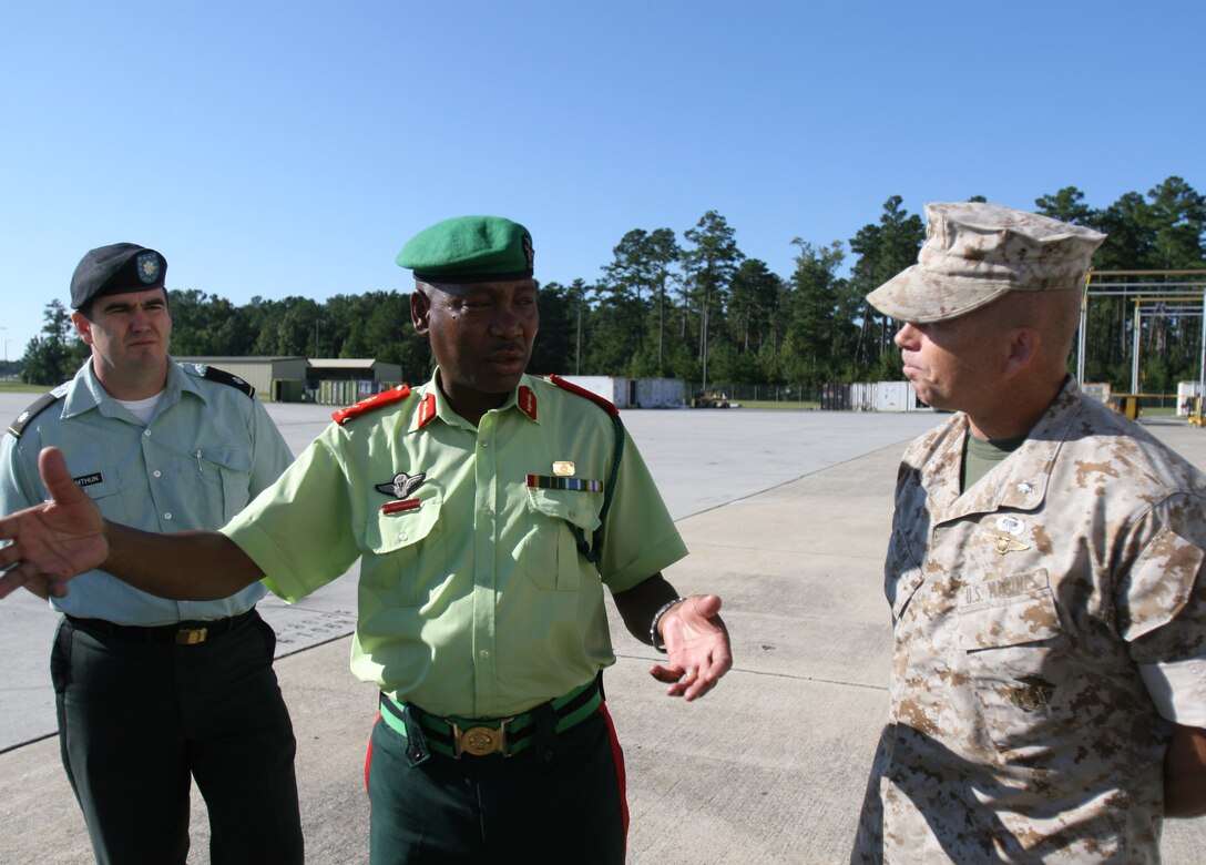 Maj. Gen. Otisitswe B. Tiroyamodimo, deputy commander of the Botswana Defense Force talks with Lt. Col Brent W. Bien, the commanding officer of Marine Light/Attack Helicopter Squadron 167, during a tour of Marine Corps Air Station New River, N.C. by a BDF delegation, Sept. 30, 2009.  The delegation’s visit was a part of their multi-stop tour of U.S. military’s capabilities and instillations.