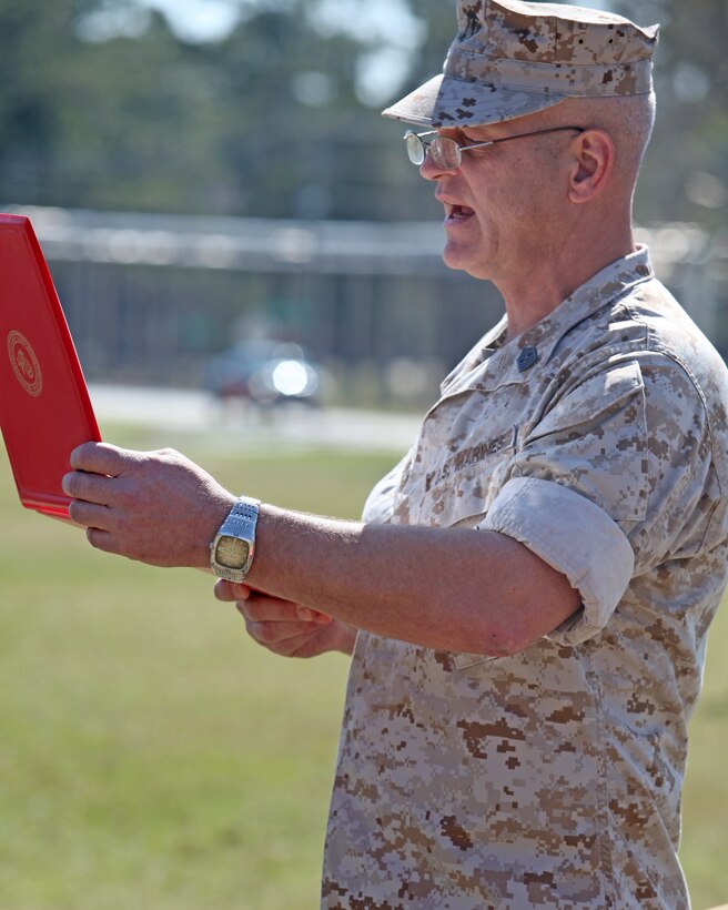 Sgt. Maj. Matthew V. Wilhelm, the battalion sergeant major for Amphibious Assault Battalion, reads the awards citations for one Bronze Star medal and six Purple Heart medals presented on April 1, 2010, aboard Marine Corps Base Camp Lejeune, N.C. Attending the ceremony and presenting the awards were 2nd Marine Division Commanding General, Maj. Gen. Richard T. Tryon and Sgt. Maj. Michael F. Jones, the 2nd Marine Division sergeant major.