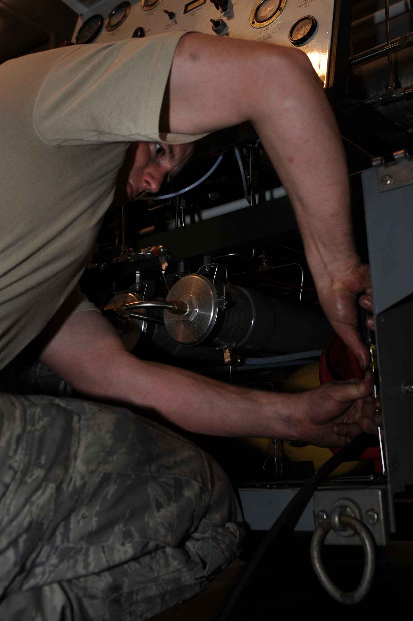 WHITEMAN AIR FORCE BASE, Mo. - Staff Sgt. David Teeters, 509th Maintenance Squadron aerospace ground equipment technician, inspects a self generating nitrogen servicing cart March 31, 2010. AGE mechanics ensure the equipment is operational to support the daily missions here. (U.S. Air Force photo/Staff Sgt. Jason Huddleston)  (Released)
