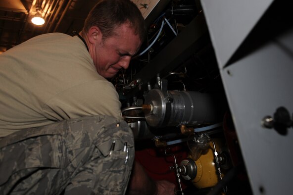 WHITEMAN AIR FORCE BASE, Mo. - Staff Sgt. David Teeters, 509th Maintenance Squadron aerospace ground equipment technician, inspects a self generating nitrogen servicing cart March 31, 2010. AGE mechanics ensure the equipment is operational to support the daily missions here. (U.S. Air Force photo/Staff Sgt. Jason Huddleston)  (Released)