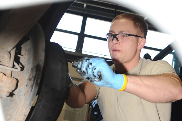 WHITEMAN AIR FORCE BASE, Mo. - Senior Michael Moser, 509th Logistics Readiness Squadron vehicle equipment mechanic,  performs a brake rebuild on a government truck. The mechanics perform daily maintenance on government vehicles to insure they are fully operational.  Along with maintenance, mechanics also perform their own upholstery and body work on government vehicles. (U.S. Air Force photo/Staff Sgt. Jason Huddleston)  (Released)