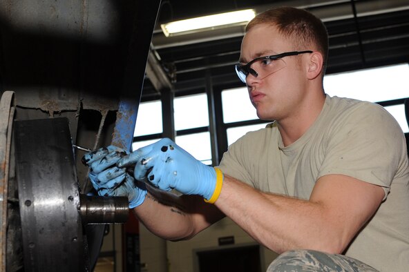 WHITEMAN AIR FORCE BASE, Mo. - Senior Airman Michael Moser, 509th Logistics Readiness Squadron vehicle equipment mechanic, rebuilds the brake pads on a government vehicle. The 509th LRS vehicle equipment mechanics perform daily maintenance on government vehicles to insure they are fully operational.Mechanics also perform their own upholstery and body work on government vehicles. (U.S. Air Force photo/Staff Sgt. Jason Huddleston)  (Released)