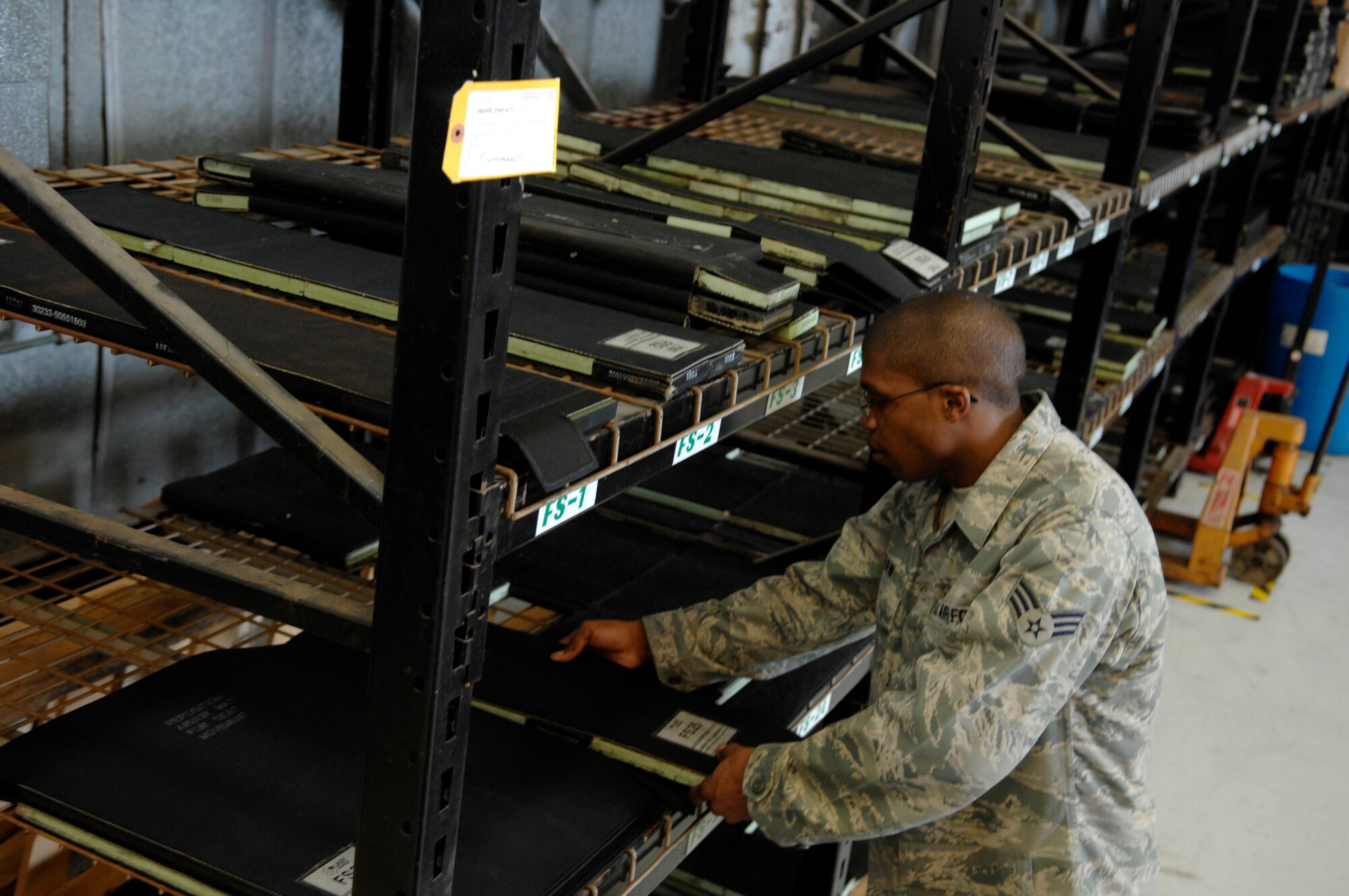 Senior Airman Michael Shaw places a piece of aircraft armor on a storage rack at the rail shop March 26, 2010, on Joint Base Charleston, S.C. The aviation armor is made of several small, ceramic-covered tiles, which are placed on industrial strength Velcro to form a fixed shape. Airman Shaw is a crew chief with the 437th Aircraft Maintenance Squadron. (U.S. Air Force photo/Senior Airman Timothy Taylor)