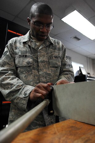 Senior Airman Michael Shaw repairs an upper centerline seat at the rail maintenance shop March 26, 2010, on Joint Base Charleston, S.C. The upper centerline seat is one part of aircraft cargo seats. Airman Shaw is a crew chief with the 437th Aircraft Maintenance Squadron. (U.S. Air Force photo/Senior Airman Timothy Taylor)