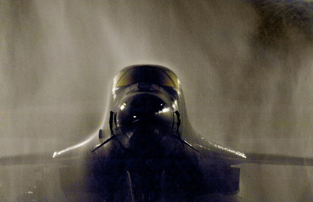 A B-1B Lancer gets a "shower" March 22, 2010, at Ellsworth Air Force Base, S.D. (U.S. Air Force photo/Lance Cheung)