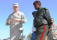 Master Sgt. James Woods (left), 319th Training Squadron, leads General Paulino Jose Macaringue, Mozambique Chief of Defense, on a tour of the Basic Expeditionary Airman Skills Training complex March 29. General Macaringue and a delegation from the Mozambique Defense Forces visited Lackland to learn how the Air Force develops Airmen. During their trip, they also met with 37th Training Wing leadership, toured basic military training dorms, and received a mission brief and tour of the Defense Language Institute English Language Center and the Robert D. Gaylor NCO Academy. (U.S. Air Force photo/Alan Boedeker)    