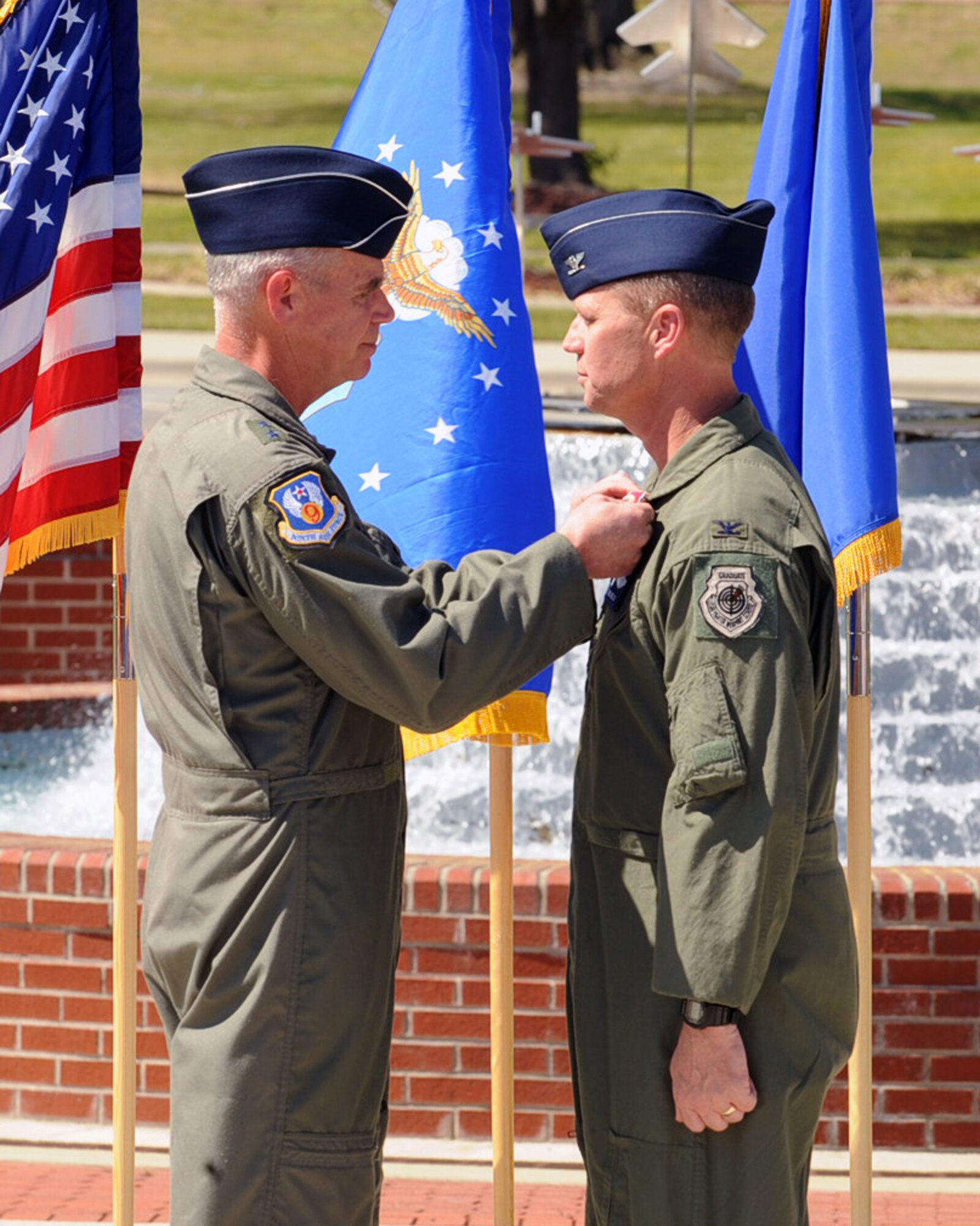SEYMOUR JOHNSON AIR FORCE BASE, N.C. --
Maj. Gen. William Holland, 9th Air Force commander, pins the Legion of Merit onto Col. Mark Kelly, former 4th Fighter Wing commander during a change of command ceremony, April 1, 2010. Col. Kelly will be reassigned as the executive assistant to the deputy commander, U.S. Pacific Command, Camp H.M. Smith, Hawaii. (U.S. Air Force photo/Senior Airman Ciara Wymbs)  