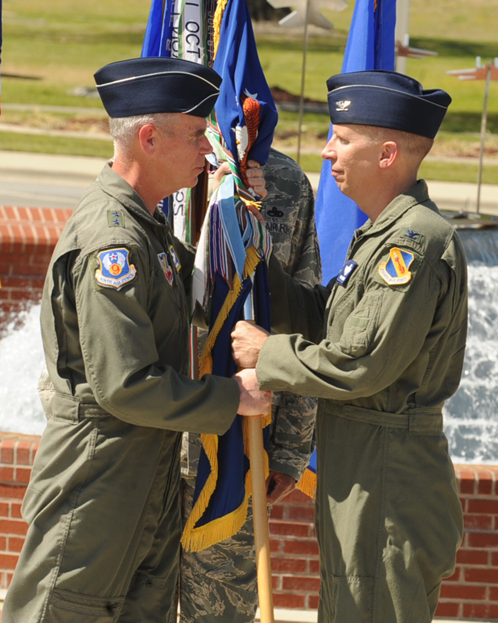 SEYMOUR JOHNSON AIR FORCE BASE, N.C. --
Maj. Gen. William Holland, 9th Air Force commander, passes the guidon to Col. Patrick Doherty during the 4th Fighter Wing change of command ceremony here, April 1, 2010.  Col. Doherty, a former 4th Fighter Wing vice commander and squadron commander, assumed command from Col. Mark Kelly. (U.S. Air Force photo/Senior Airman Ciara Wymbs) 
