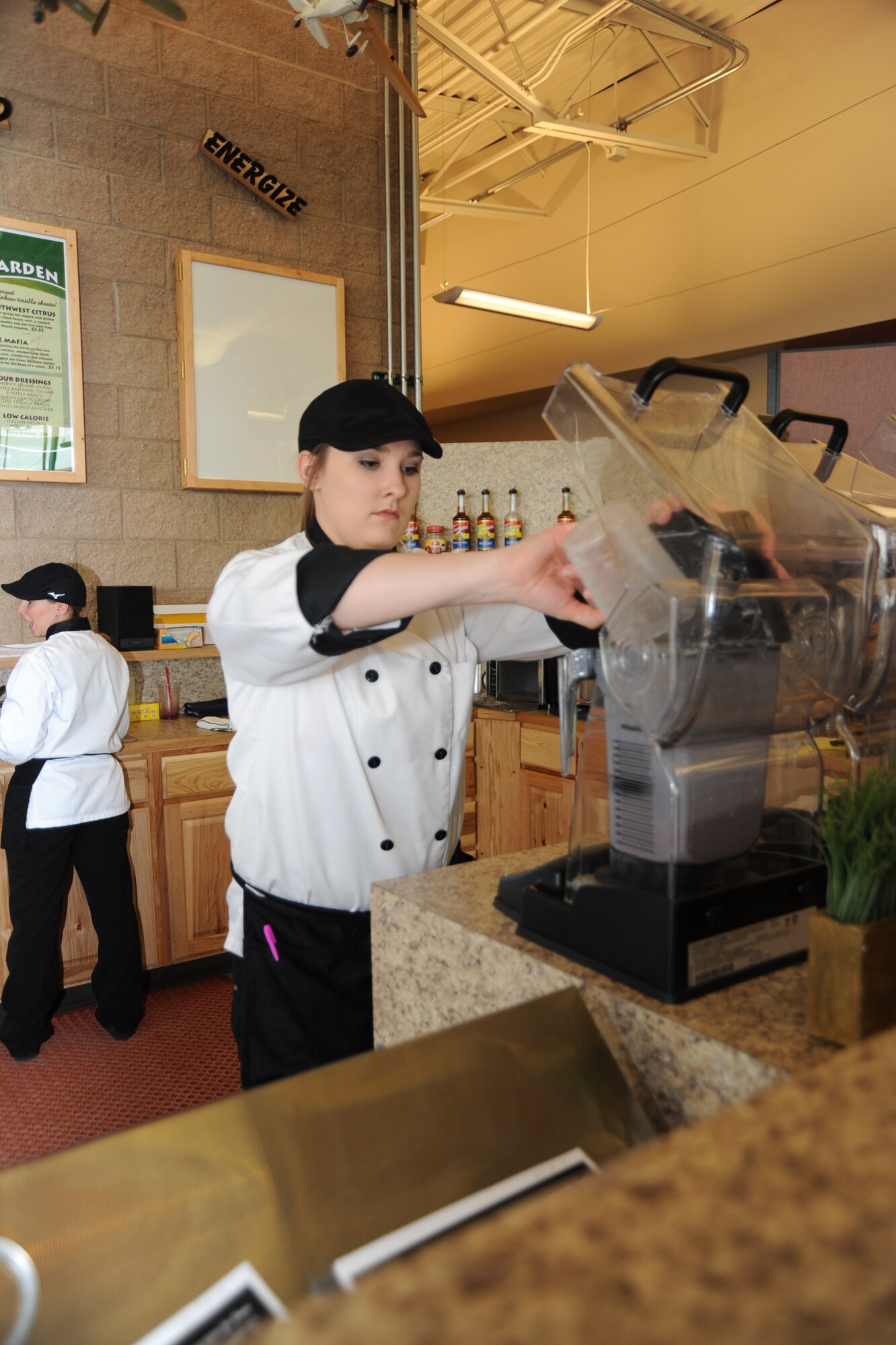 MOUNTAIN HOME AIR FORCE BASE, IDAHO – Allison Anthis, Bistro barista, prepares the smoothie mixture prior to making a strawberry banana smoothie for a customer. The bistro serves smoothies, wraps, parfaits, granola and salads as part of their menu items. The bistro is provides Gunfighters healthier eating options through their low calorie salads (U.S. Air Force photo by Airman 1st Class Renishia Richardson)