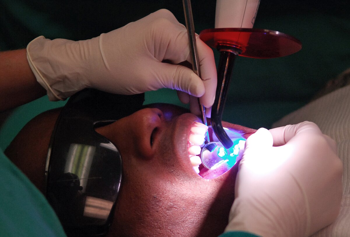 SCOTT AIR FORCE BASE, Ill. – Capt. Kelley Eltringham, 375th Dental Squadron dentist, applies sealant to a patient’s teeth to aid in fighting off cavities, March 18, 2010. Along with typical dental services, the dental facilities on Scott mold and create custom orthodontics such as removable and permanent retainers for servicemembers. (U.S. Air Force photo/ Senior Airman Ryan Crane)