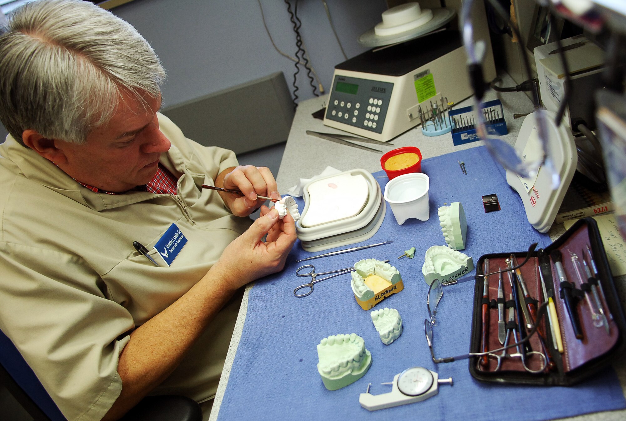 SCOTT AIR FORCE BASE, Ill. – Timothy Lashley, 375th Dental Squadron laboratory technician, touches up a plaster mold of a patient’s teeth March 18, 2010. Along with typical dental services, the dental facilities on Scott mold and create custom orthodontics such as removable and permanent retainers for servicemembers. (U.S. Air Force photo/ Senior Airman Ryan Crane)
