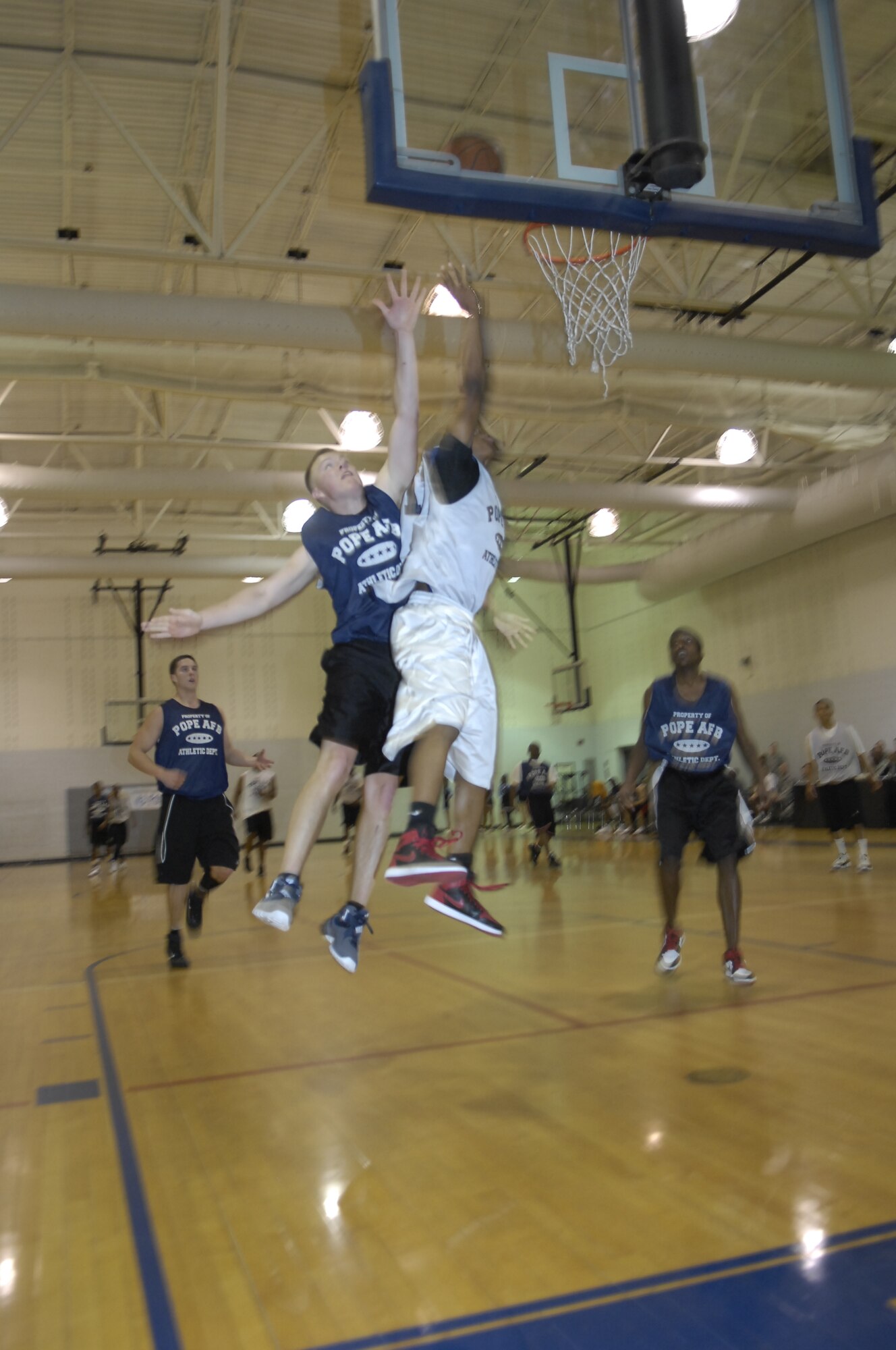 Robert Jones, 43rd Logistic Readiness Squadron Cobra, attempts a lay-up at the Pope Intramural Basketball Championship March 24. The Cobras defeated the 43rd Force Support Squadron with a score of 41 to 33. (U.S. Air Force photo/2nd Lt. Cammie Quinn)