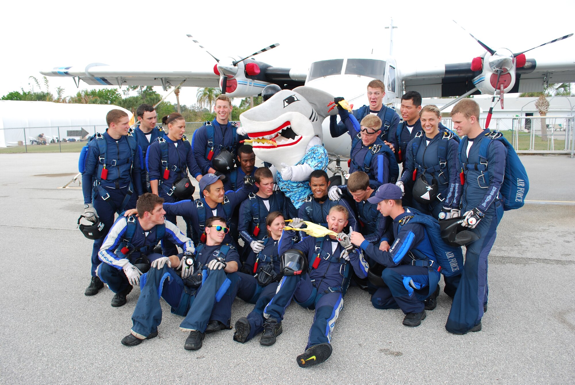 45th Space Wing mascot Snark the Shark paid a visit to the Wings of Blue parachute
team during their practice in the local area March 26. Snark asked the team to help
show some support for the Sharks in the upcoming Guardian Challenge and they
happily obliged. (U.S. Air Force photo/Maj. Greg Harland)
