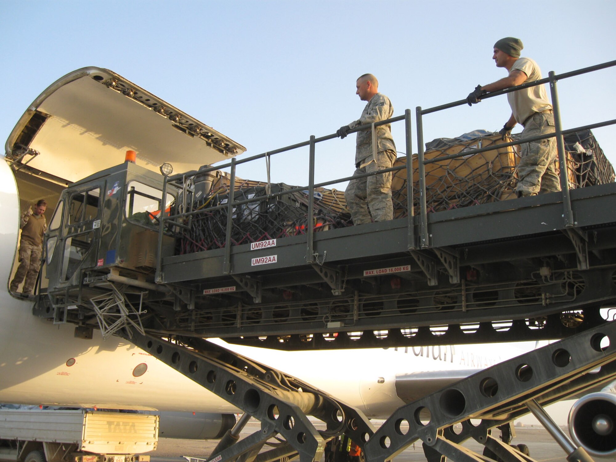Tech. Sgt. Robert Brown and Airman 1st Class Seth Nobrega prepare cargo for loading aboard an aircraft March 12, 2010, at Camp Bastion, Afghanistan. Sergeant Brown and Airman Nobrega are assigned to the 570th Global Mobility Squadron. (U.S. Air Force photo)
