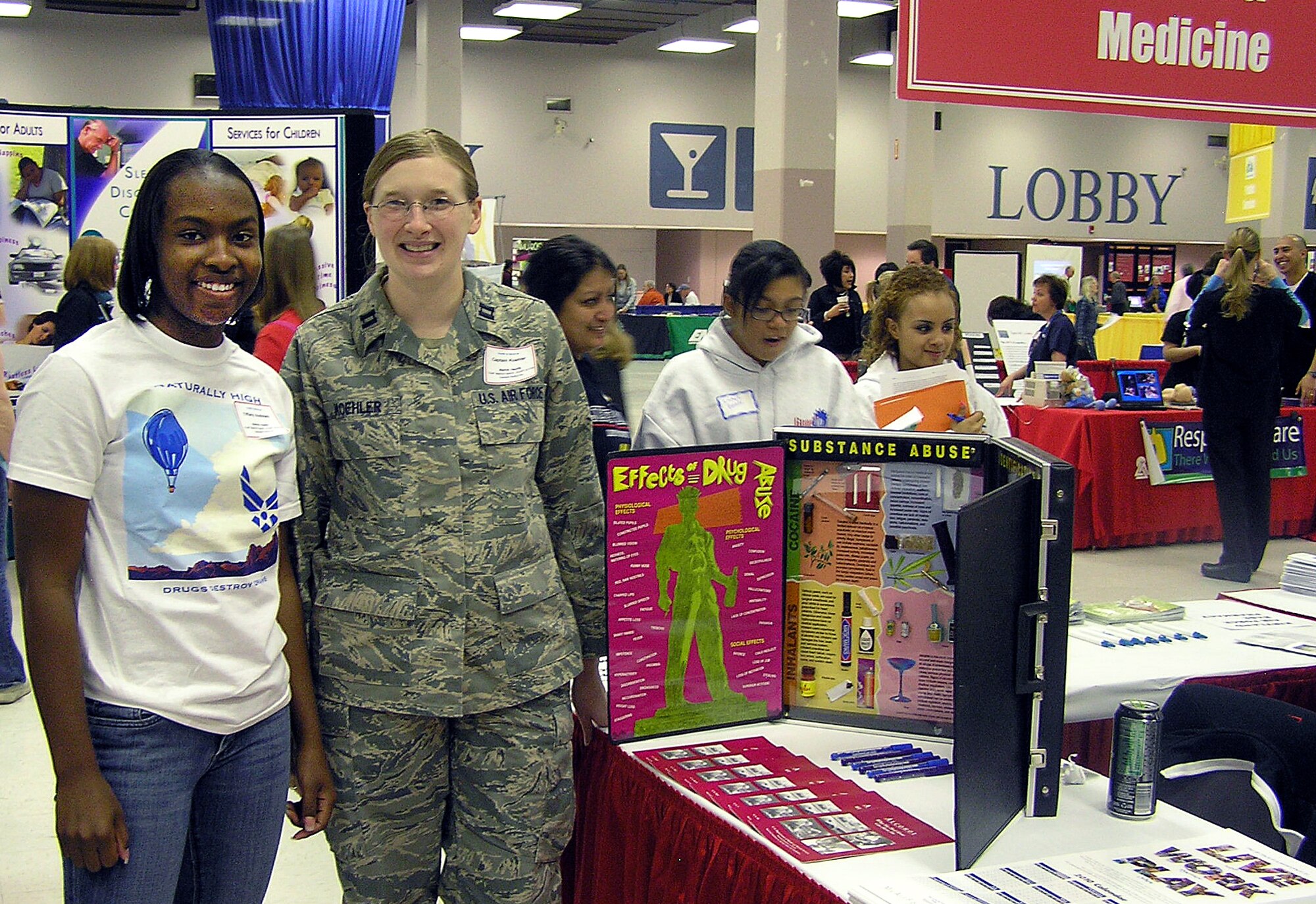 Capt. Kelly E. Koehler, 377th Medical Operations Squadron, stands with a student during the 11th Annual School to World event at the Albuquerque Convention Center Feb. 27. Several organizations from Team Kirtland were at the event to present some of life?s many destinations, choices and importance. This year, 1,725 students, 374 parents, chaperones, teachers and siblings attended, with  500 presenters representing over 150 occupations. A total of 78 schools were represented, 27 Albuquerque Public Schools, 29 public schools outside of Albuquerque and 22 private, charter and home schools. Survey results showed that everyone concerned was pleased with the event, especially the interactive components and of course, the free stuff.

Photo by Delia Tamez